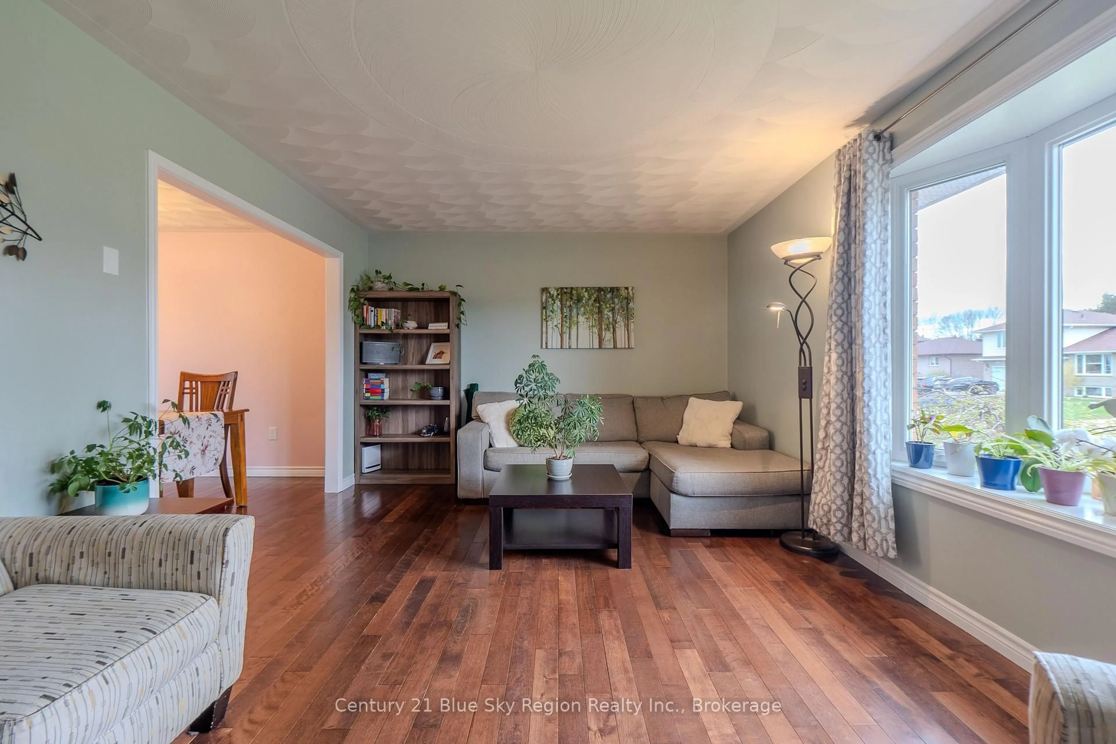 Living room with furniture, wood/laminate floor for 66 Veronica Dr, North Bay Ontario P1B 9K4