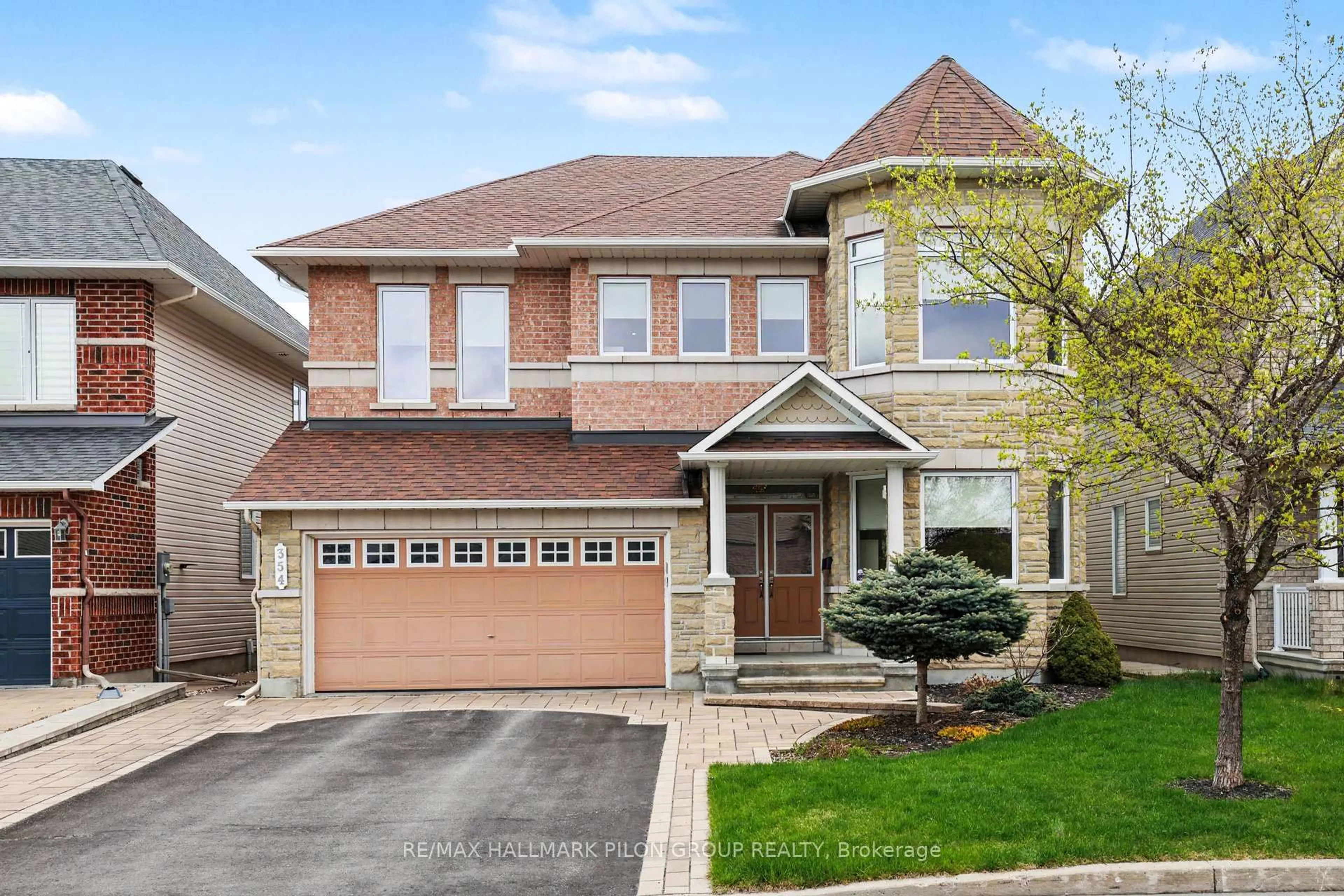 Home with brick exterior material, street for 354 Oakcrest Way, Ottawa Ontario K4A 0S5