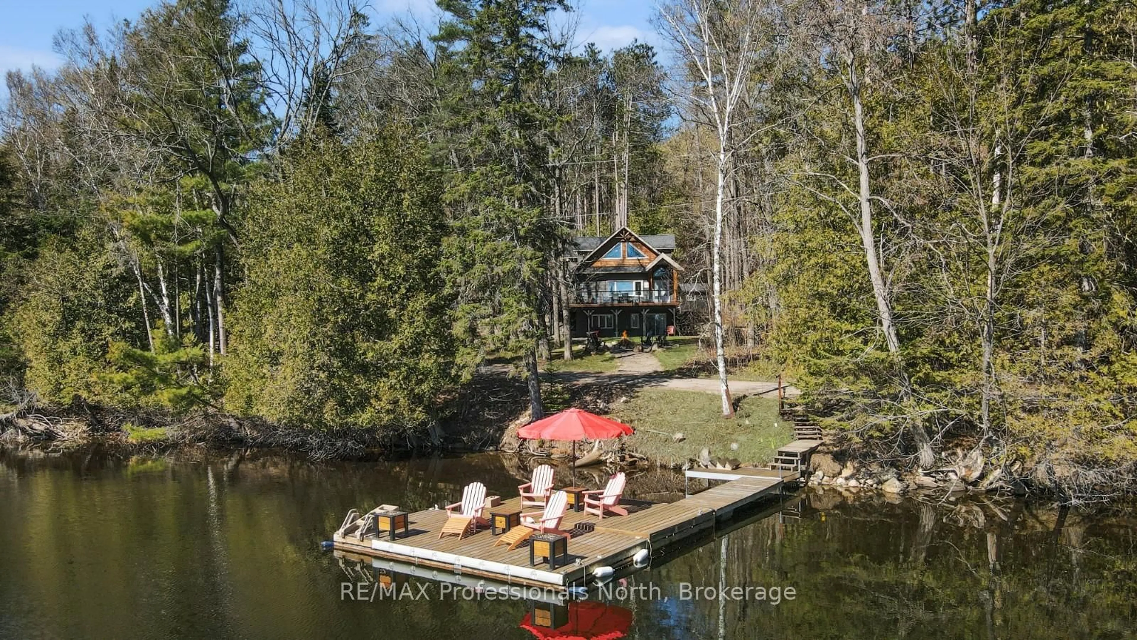 A pic from outside/outdoor area/front of a property/back of a property/a pic from drone, water/lake/river/ocean view for 1125 Caribou Rd, Minden Hills Ontario K0M 2K0