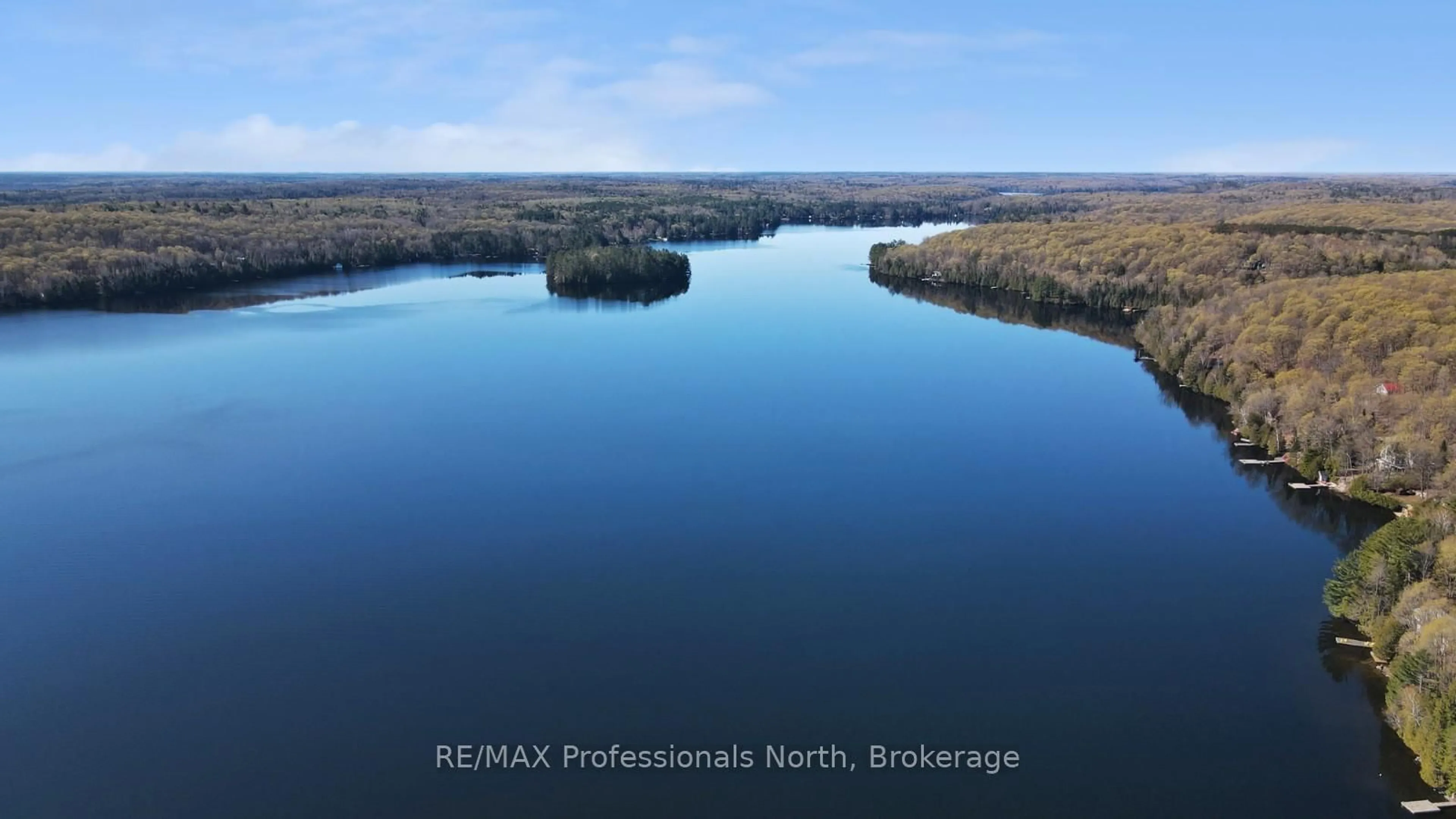 A pic from outside/outdoor area/front of a property/back of a property/a pic from drone, water/lake/river/ocean view for 1125 Caribou Rd, Minden Hills Ontario K0M 2K0