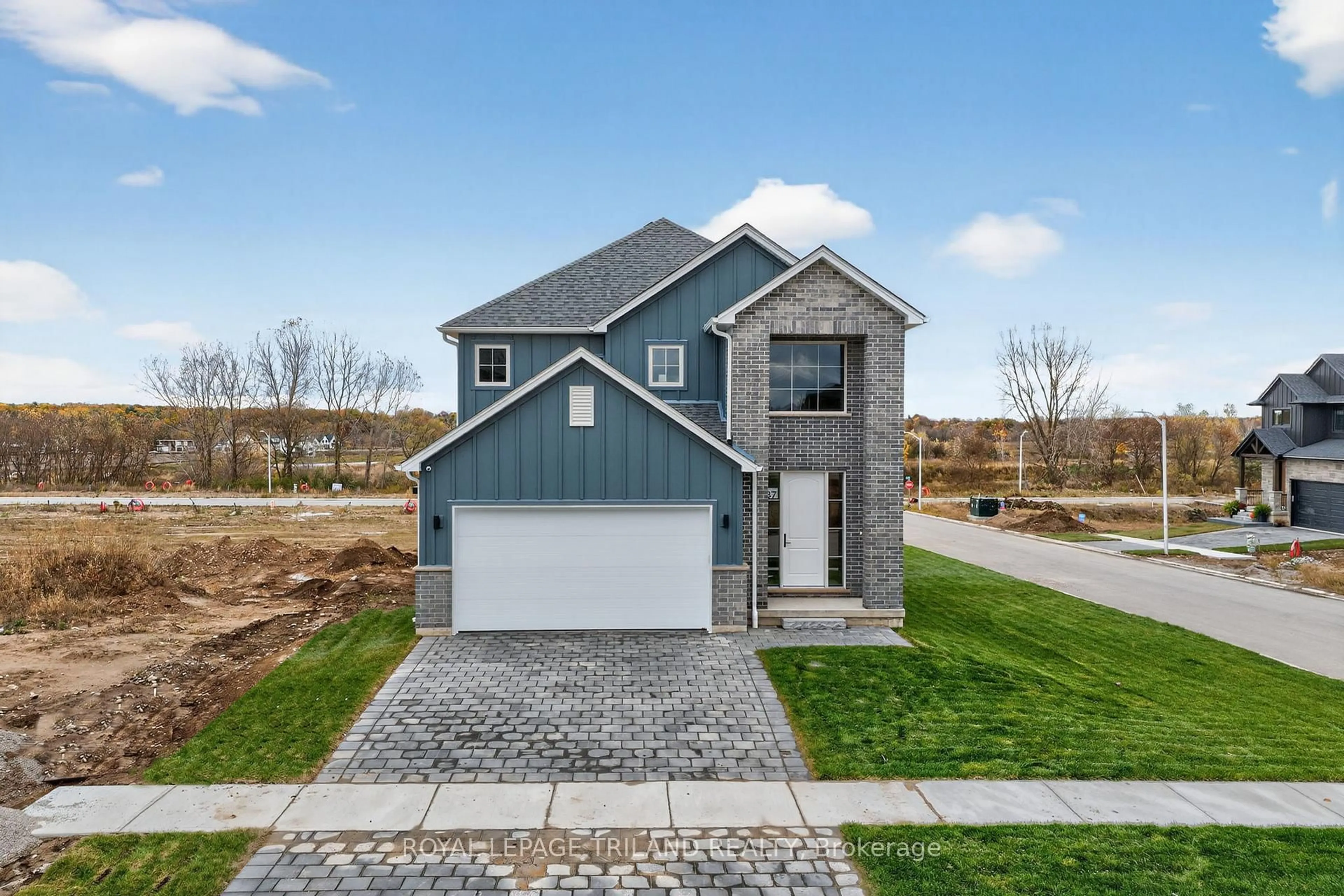 Home with brick exterior material, street for 27 Allister Dr, Middlesex Centre Ontario N0L 1R0