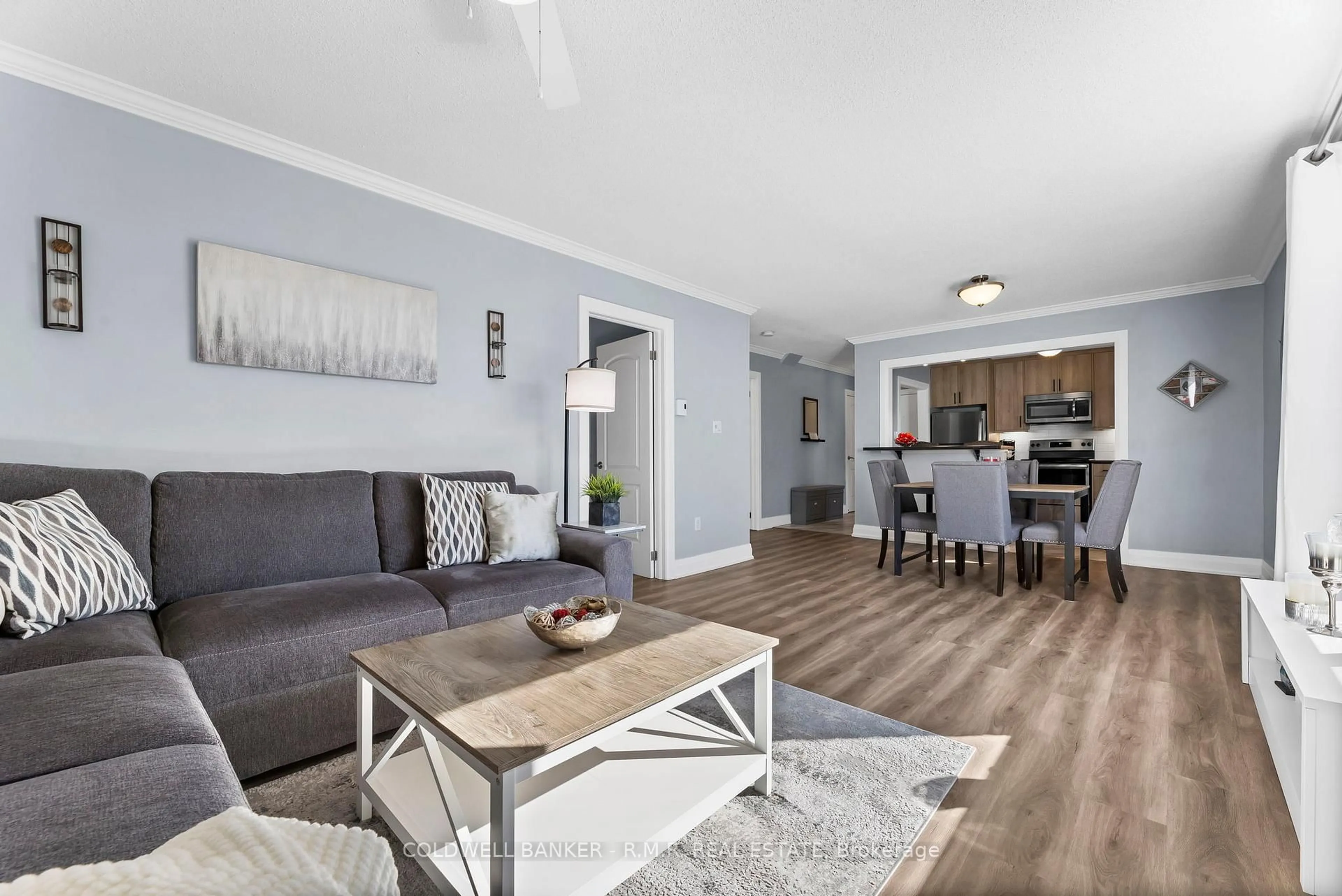 Living room with furniture, wood/laminate floor for 26 Spencer St #201, Cobourg Ontario K9A 1C2
