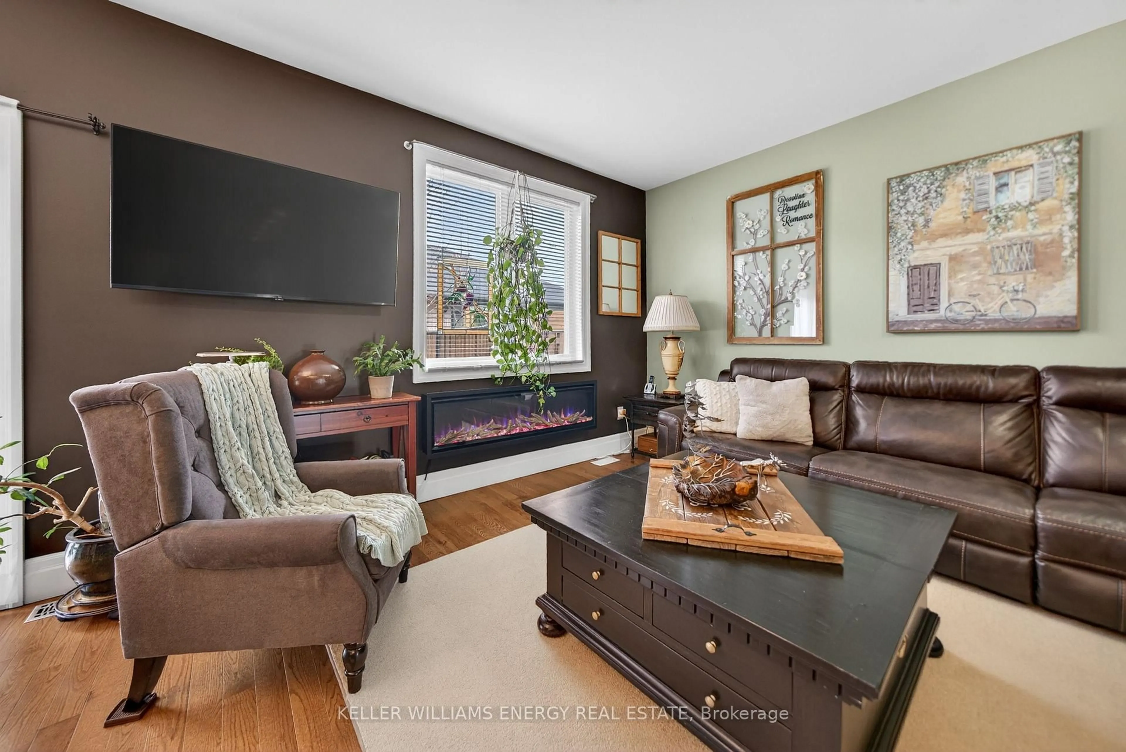 Living room with furniture, wood/laminate floor for 32 Curtis St, Prince Edward County Ontario K0K 2T0