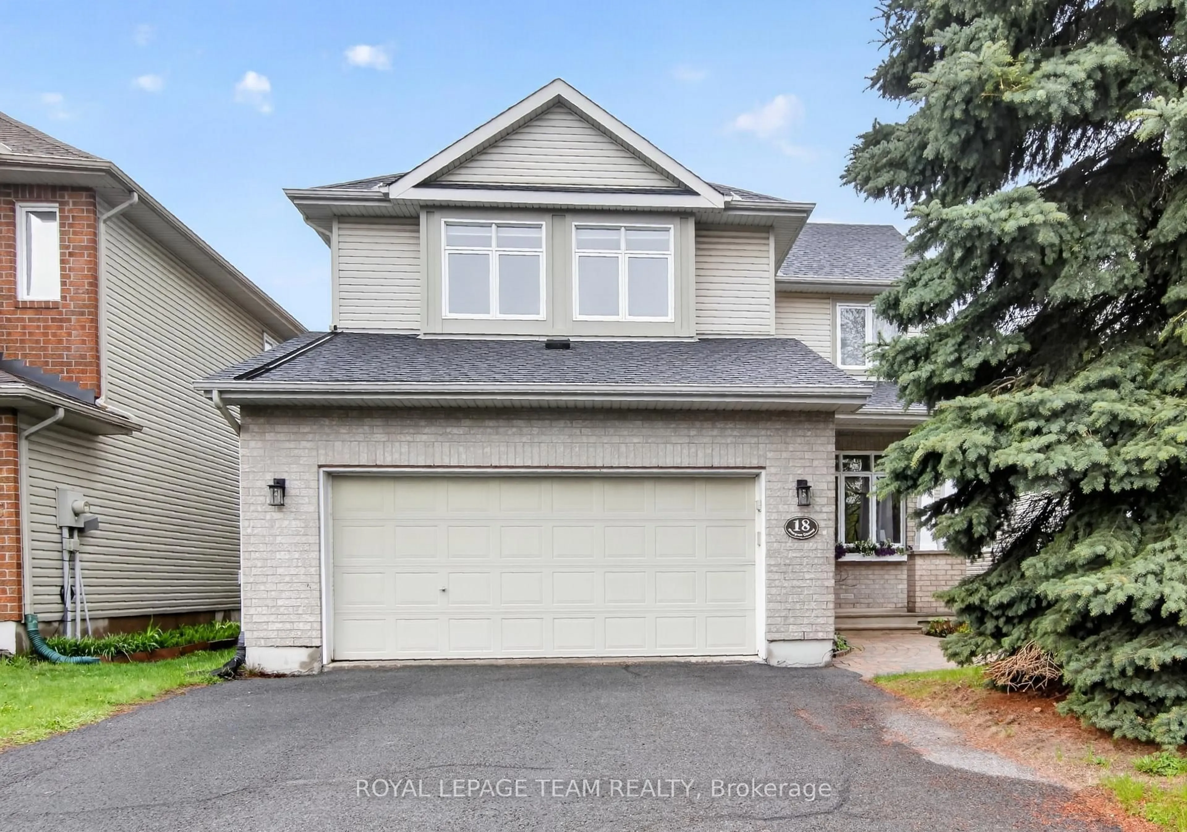 Home with vinyl exterior material, street for 18 Rivergreen Cres, Ottawa Ontario K2M 2E1