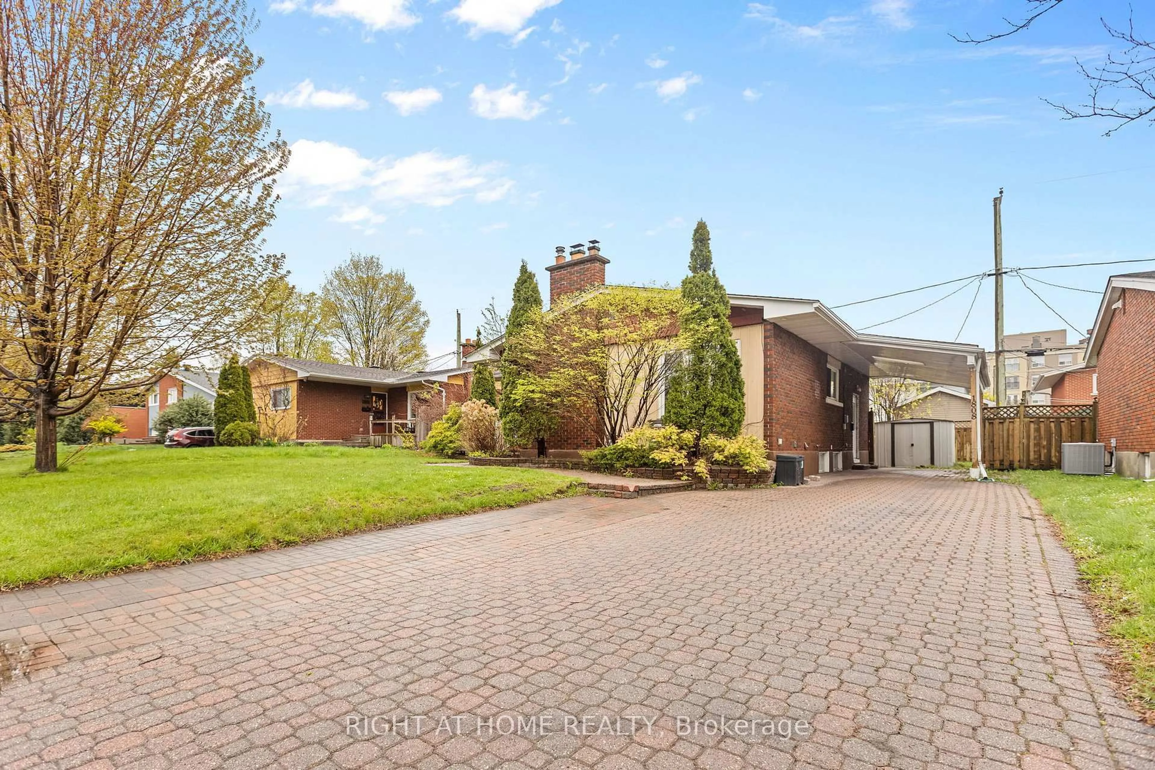 A pic from outside/outdoor area/front of a property/back of a property/a pic from drone, street for 1808 Gilbert Ave, Ottawa Ontario K2C 1A4