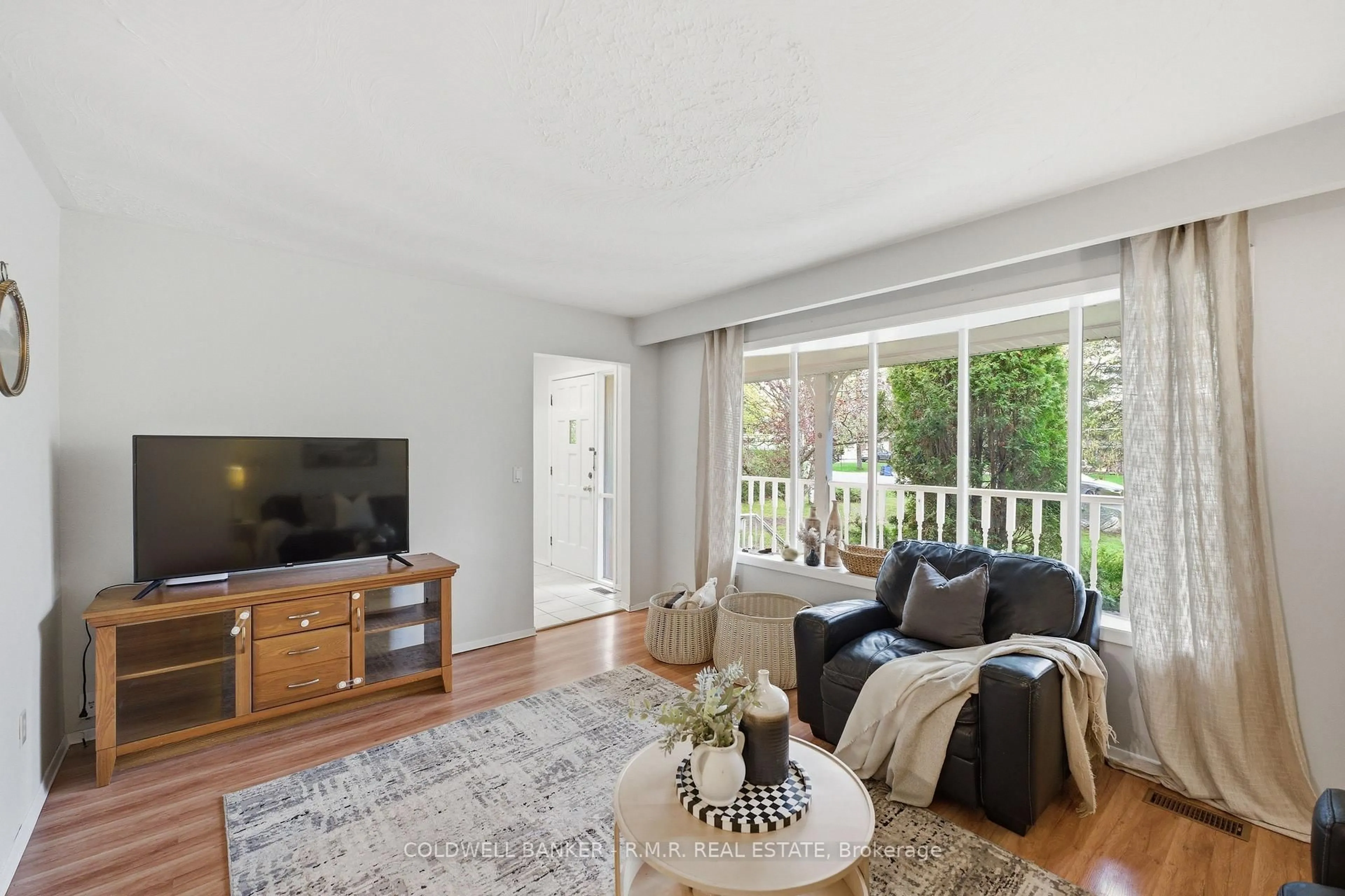 Living room with furniture, wood/laminate floor for 16 Manvers Dr, Kawartha Lakes Ontario L0B 1K0