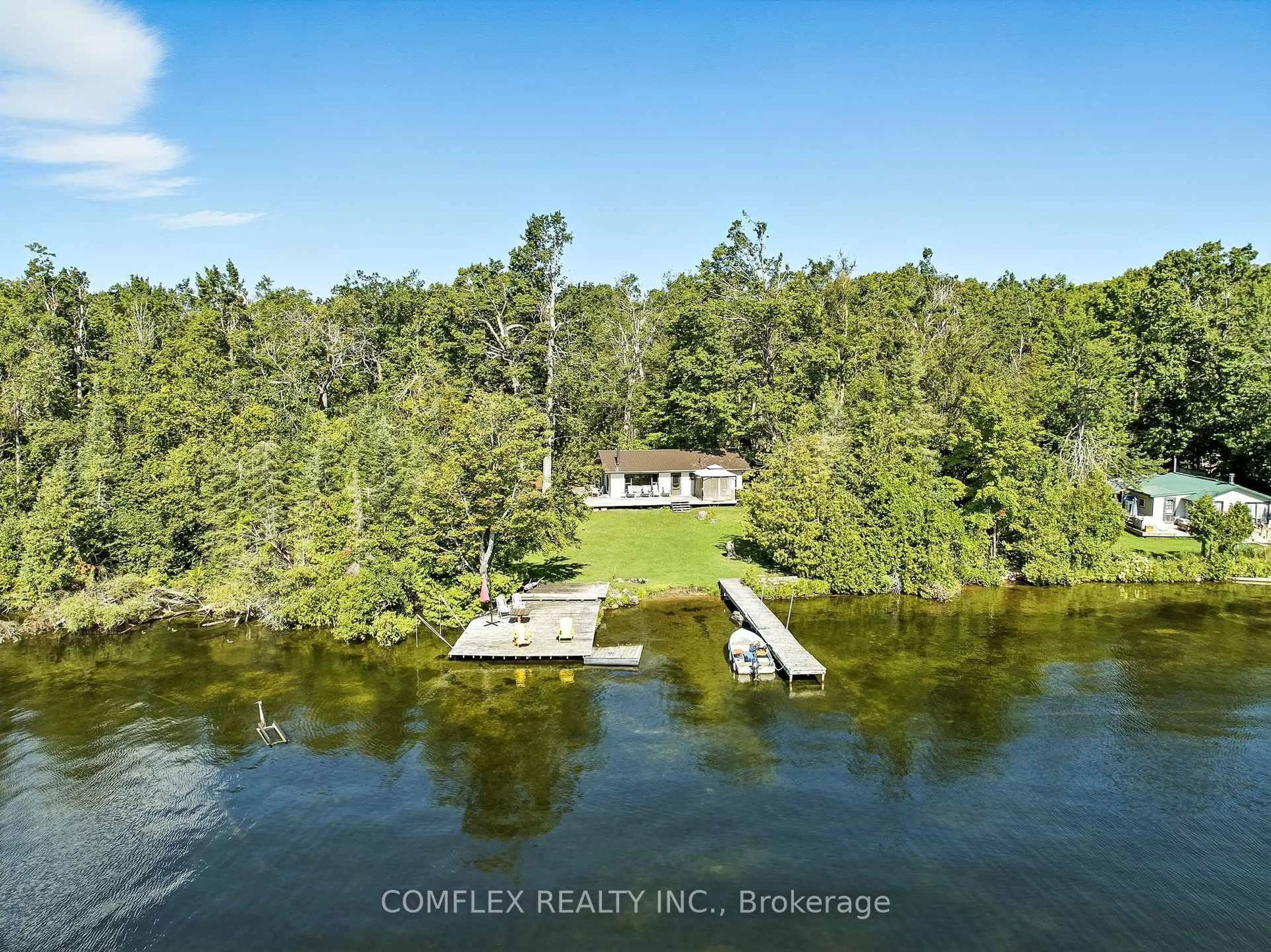 A pic from outside/outdoor area/front of a property/back of a property/a pic from drone, water/lake/river/ocean view for 633 Grand Island, Kawartha Lakes Ontario K0M 1G0