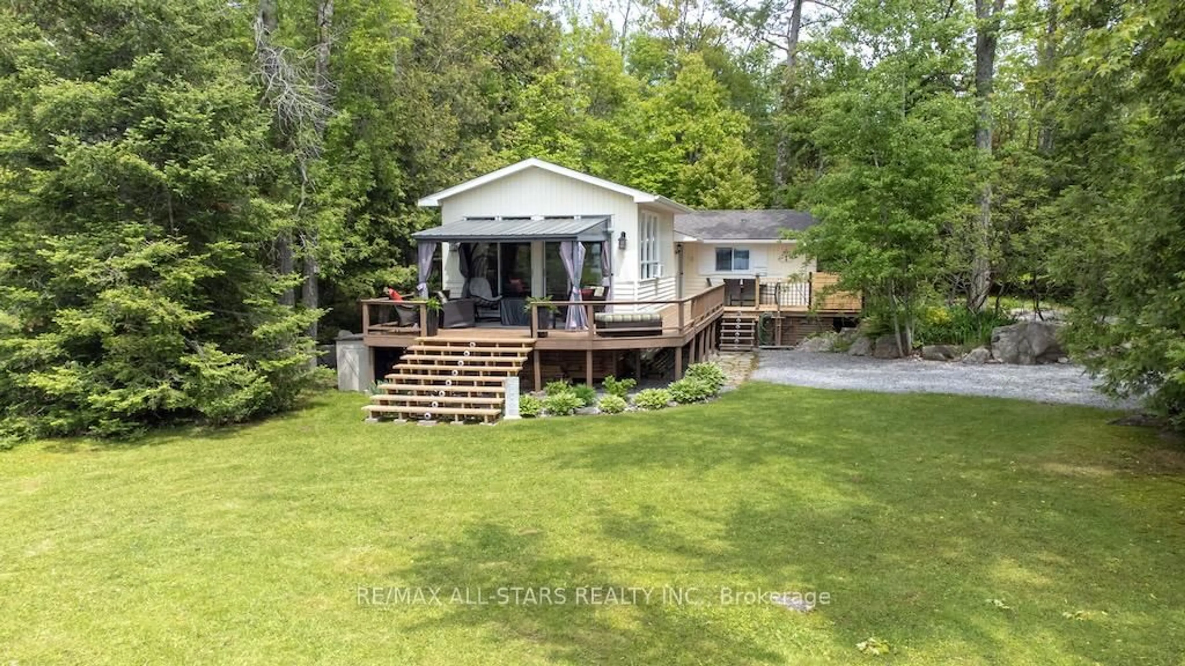 A pic from outside/outdoor area/front of a property/back of a property/a pic from drone, water/lake/river/ocean view for 6 Fire Route 14B Rte, Trent Lakes Ontario K0L 1J0