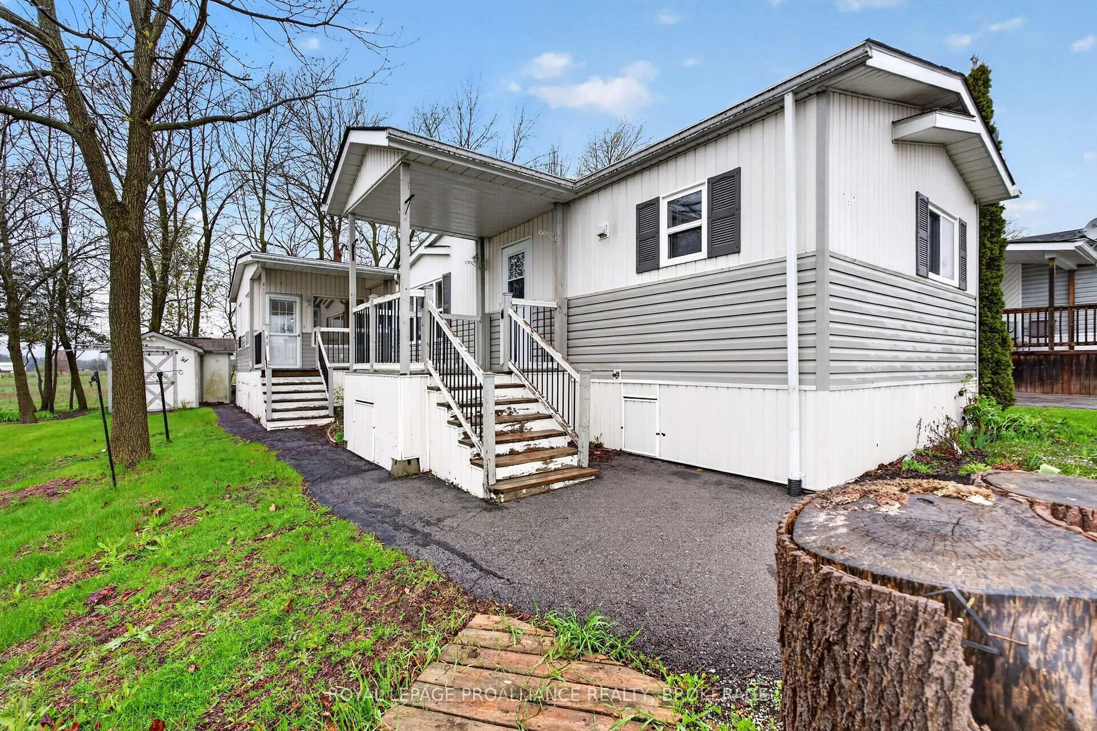 Home with vinyl exterior material, street for 1 Elm St, Greater Napanee Ontario K7R 0E9