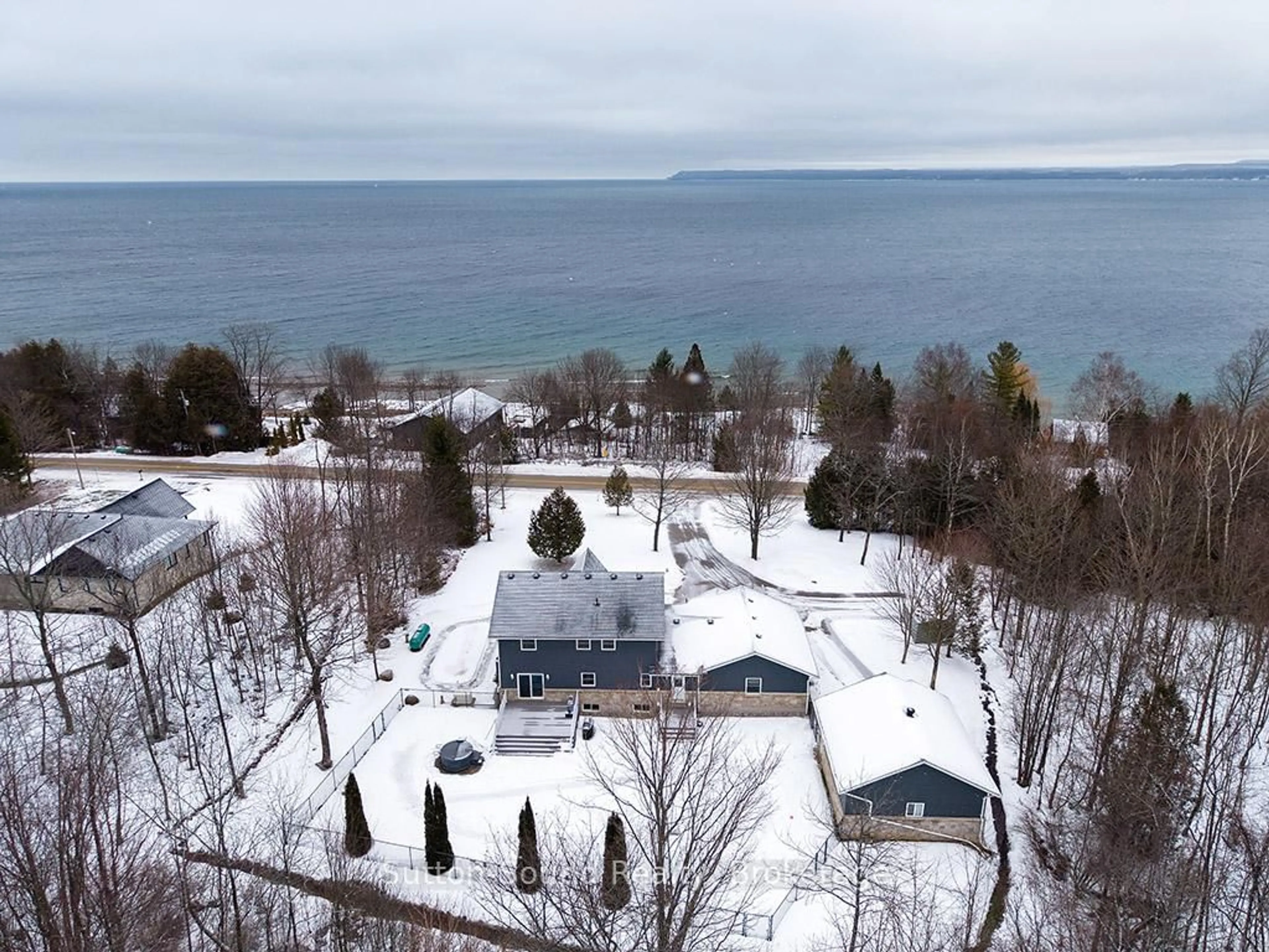 A pic from outside/outdoor area/front of a property/back of a property/a pic from drone, water/lake/river/ocean view for 505396 Grey Road 1 Rd, Georgian Bluffs Ontario N0H 2T0