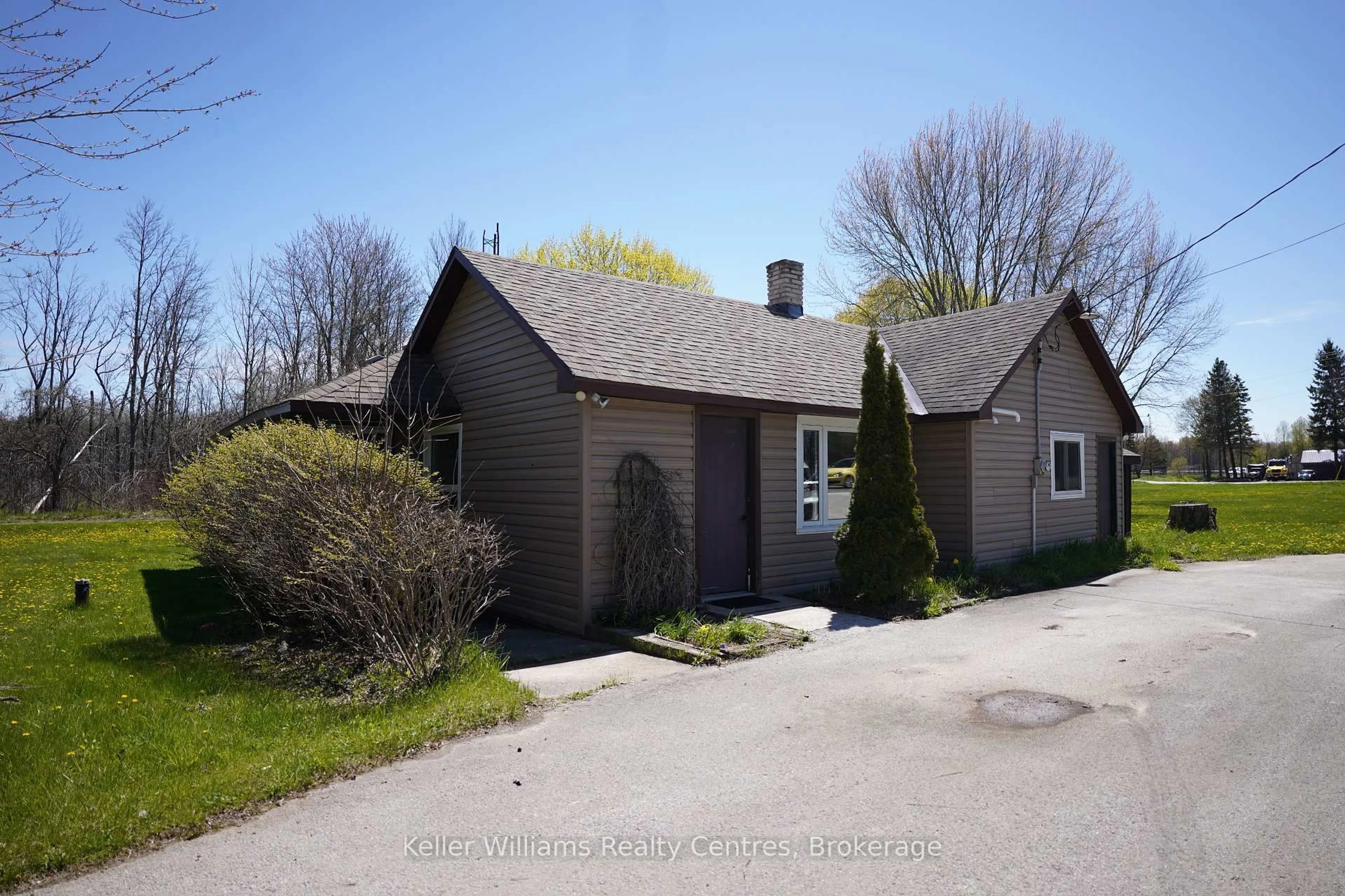 A pic from outside/outdoor area/front of a property/back of a property/a pic from drone, street for 19549 Highway 6, Georgian Bluffs Ontario N0H 2T0