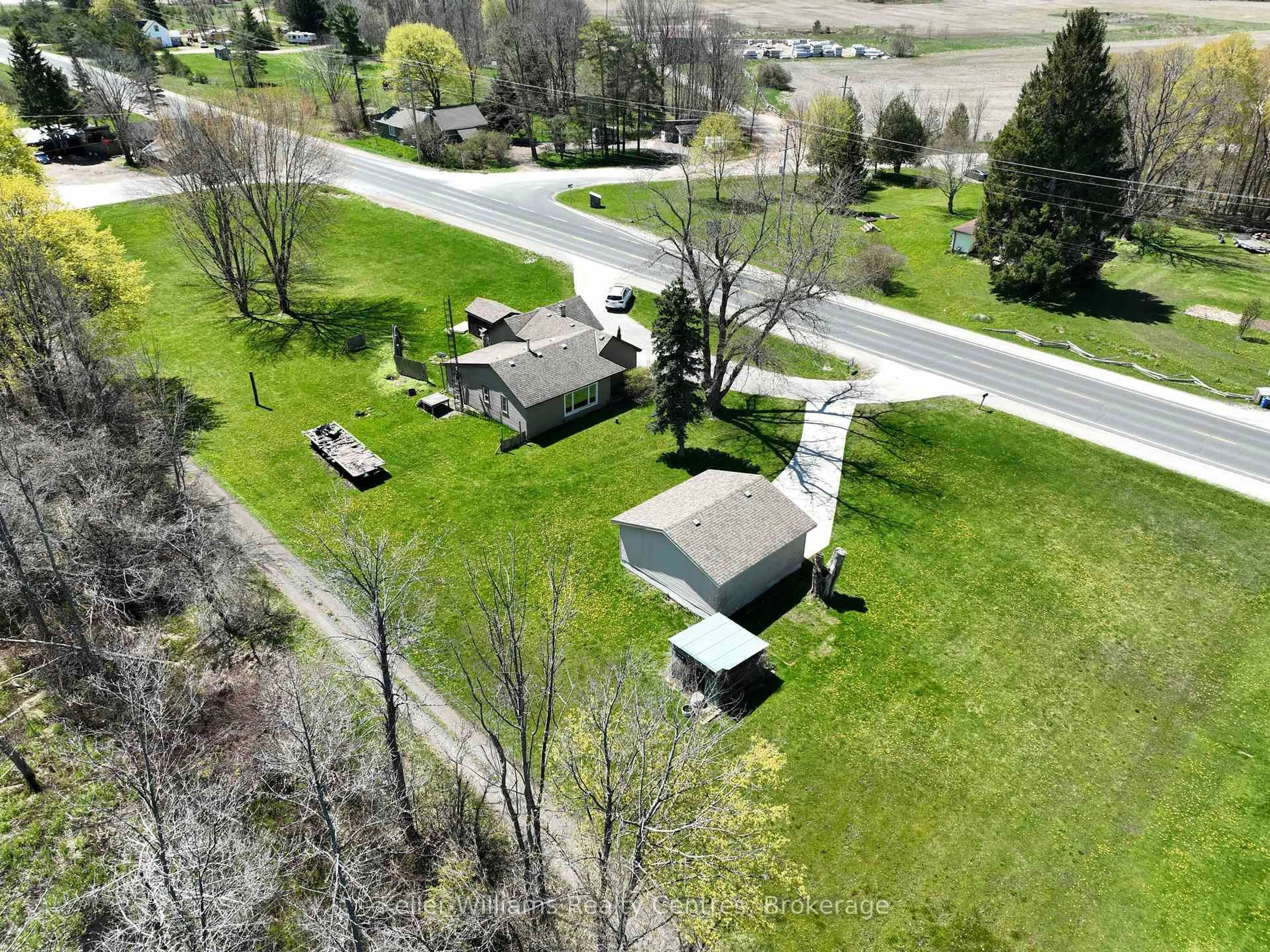 A pic from outside/outdoor area/front of a property/back of a property/a pic from drone, unknown for 19549 Highway 6, Georgian Bluffs Ontario N0H 2T0
