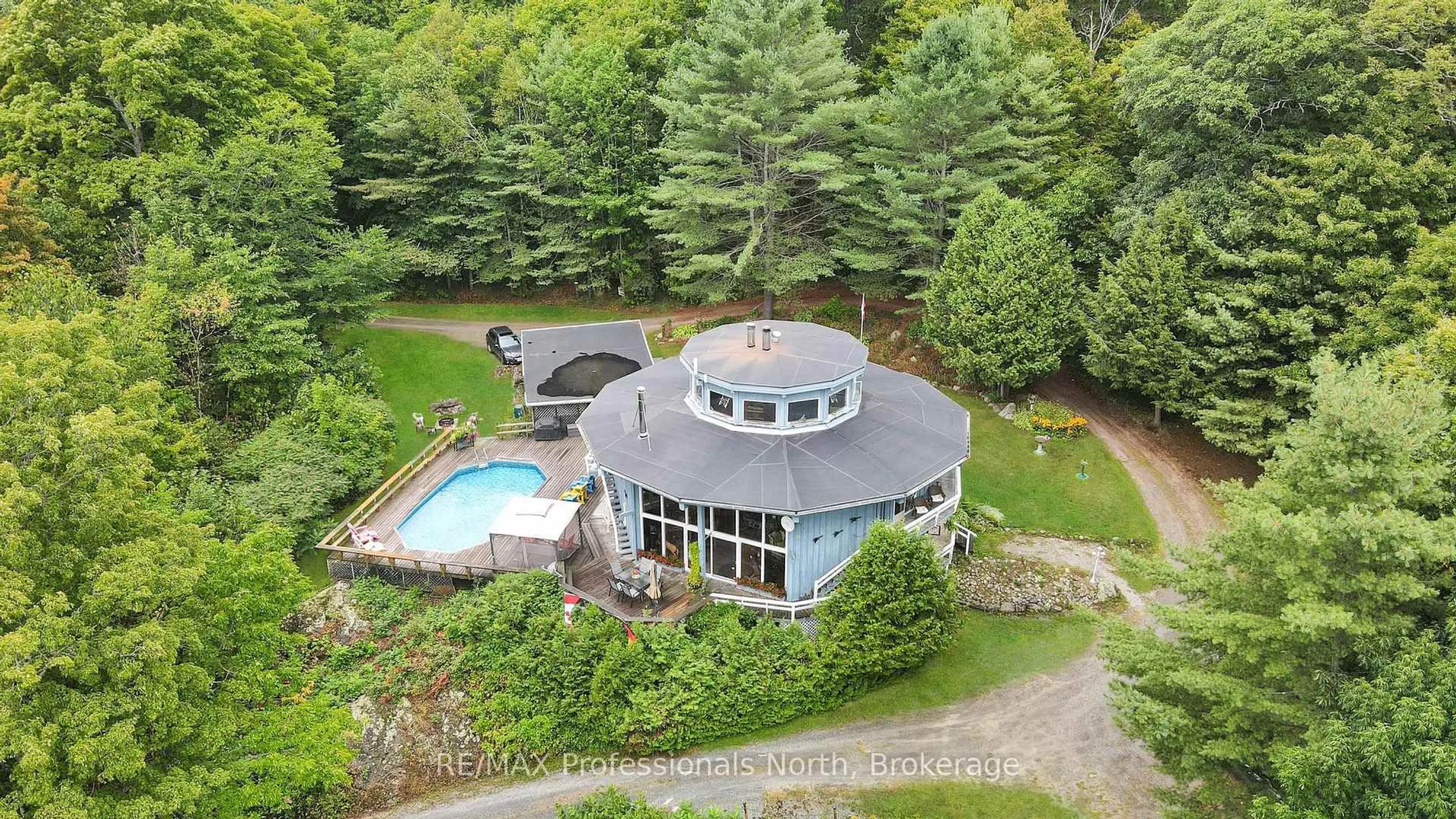 A pic from outside/outdoor area/front of a property/back of a property/a pic from drone, water/lake/river/ocean view for 17359 Highway 35, Algonquin Highlands Ontario K0M 1S0