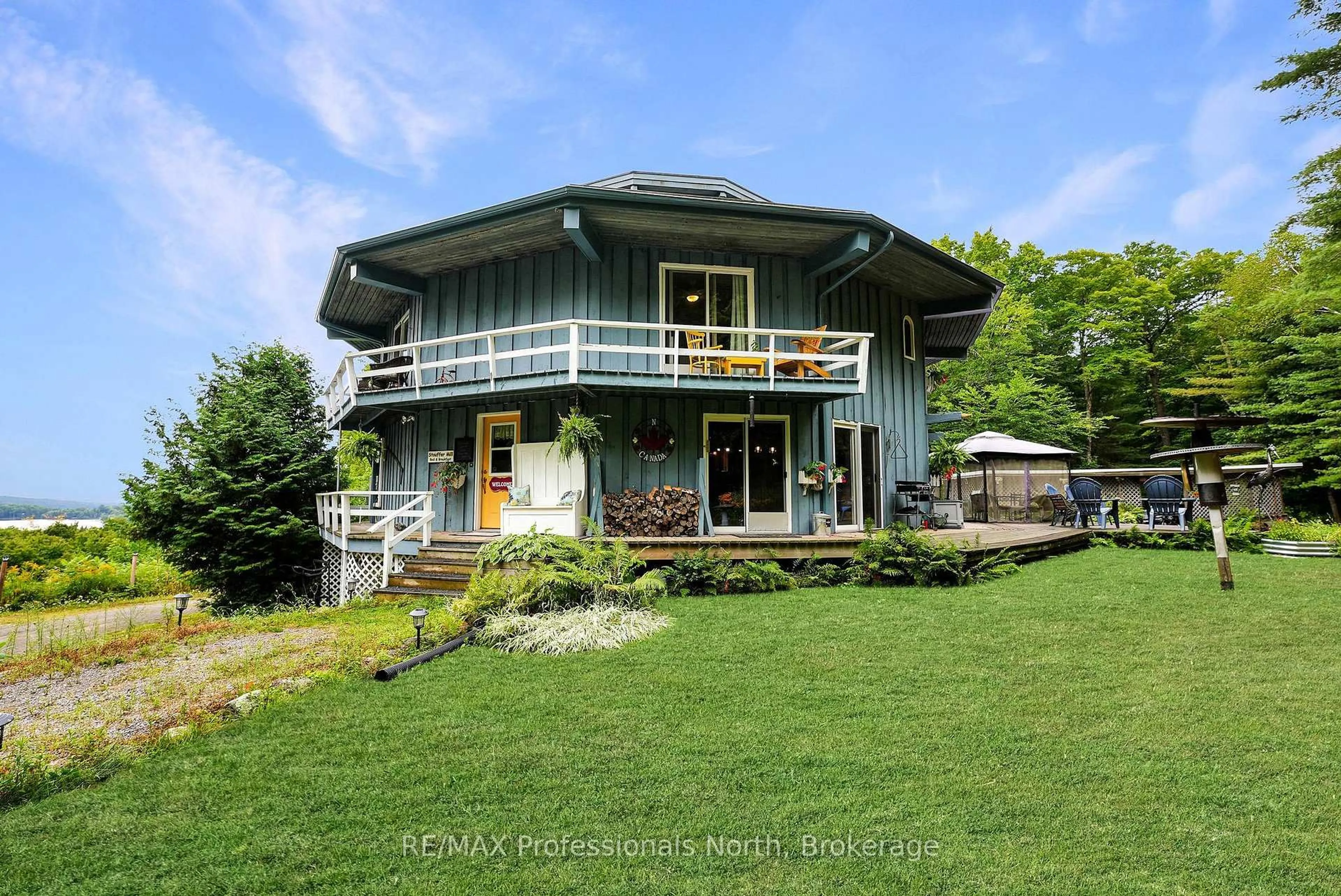 A pic from outside/outdoor area/front of a property/back of a property/a pic from drone, water/lake/river/ocean view for 17359 Highway 35, Algonquin Highlands Ontario K0M 1S0