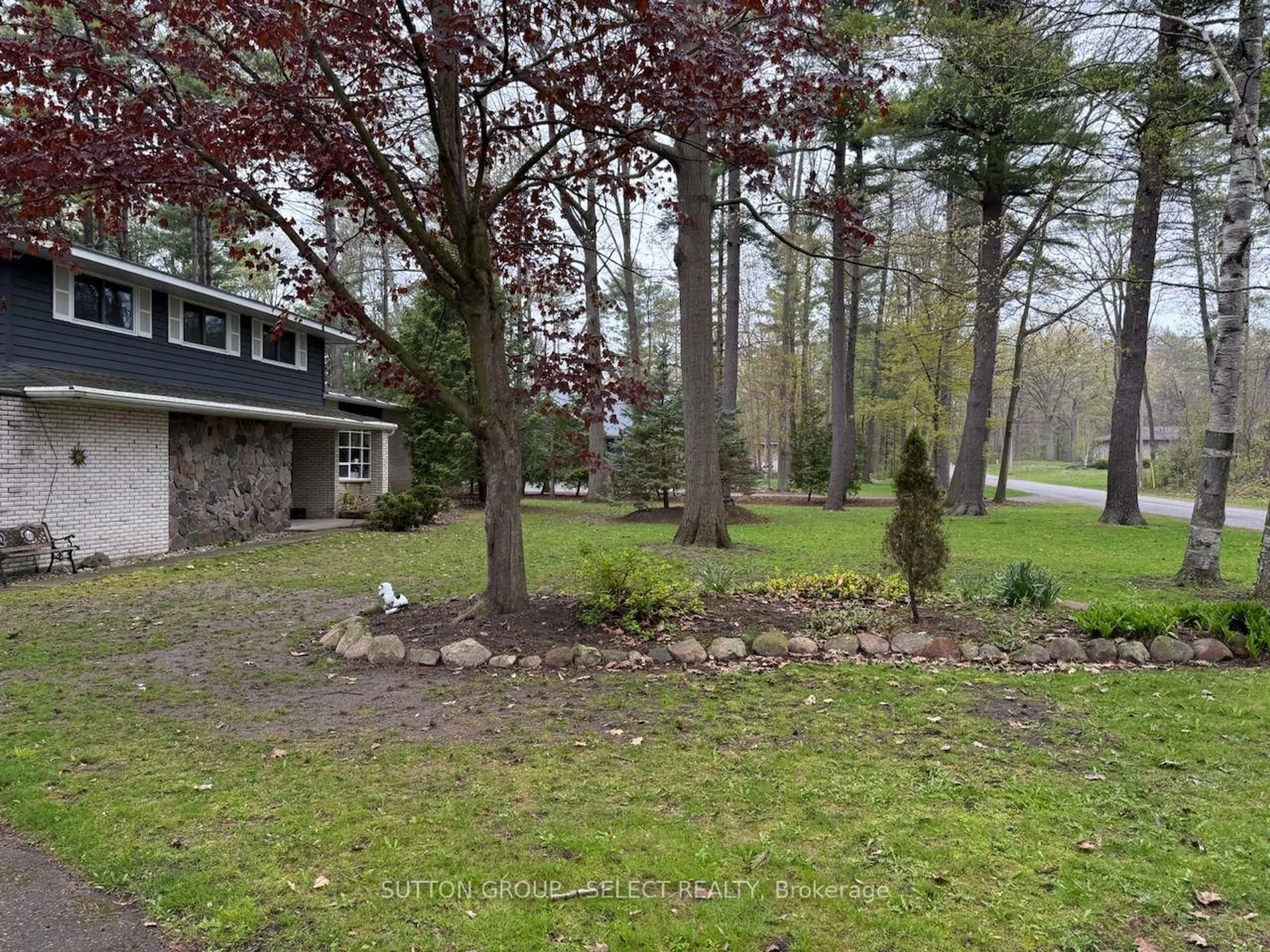 A pic from outside/outdoor area/front of a property/back of a property/a pic from drone, forest/trees view for 10103 Jane St, Lambton Shores Ontario N0M 1T0