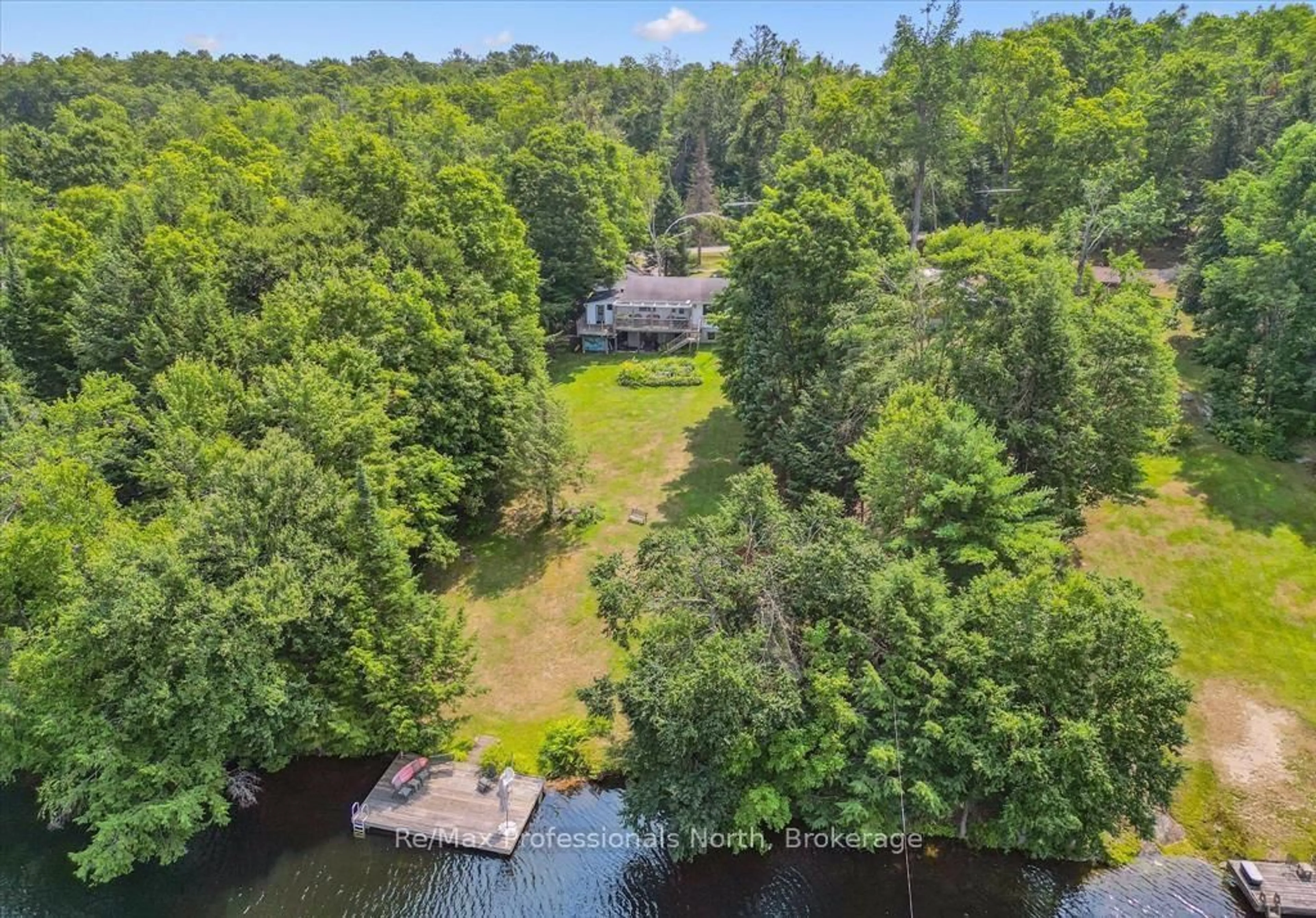 A pic from outside/outdoor area/front of a property/back of a property/a pic from drone, water/lake/river/ocean view for 1042 River Haven Rd, Bracebridge Ontario P1L 1X1