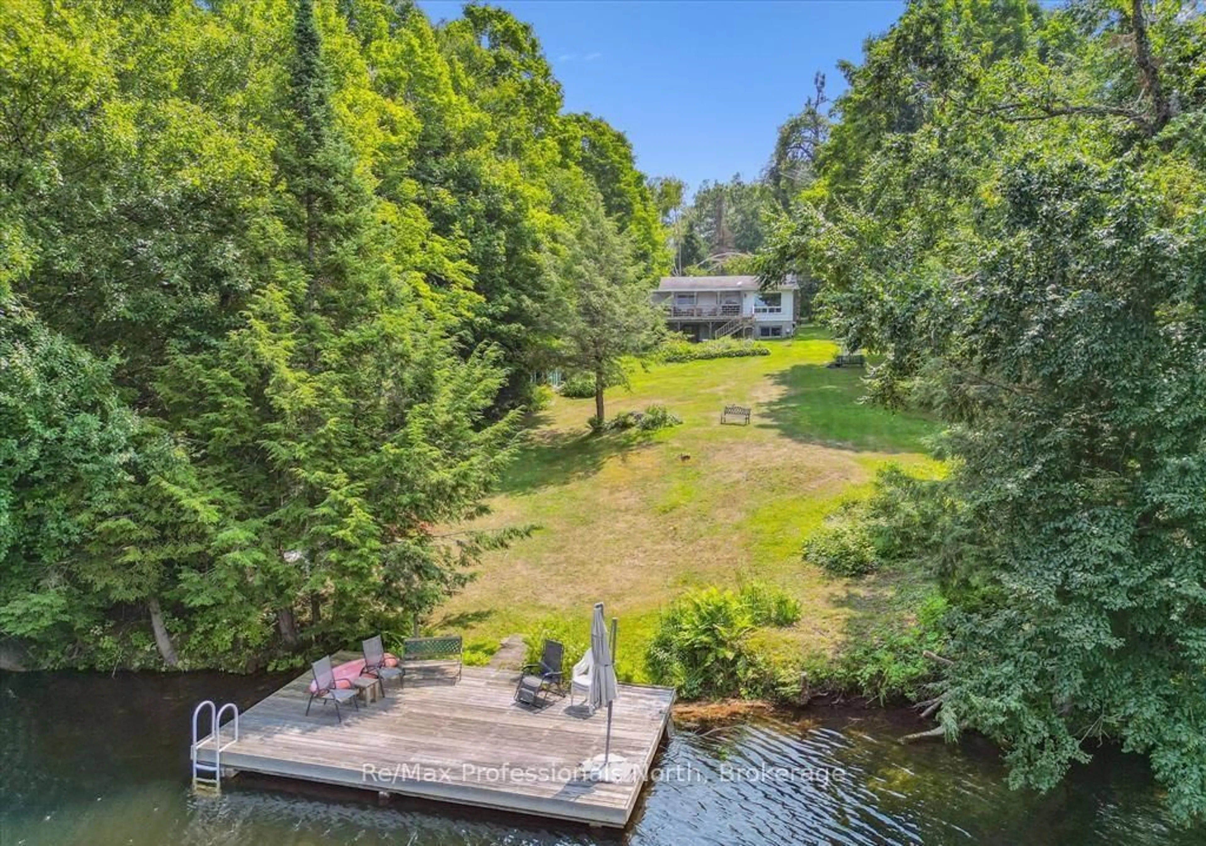A pic from outside/outdoor area/front of a property/back of a property/a pic from drone, water/lake/river/ocean view for 1042 River Haven Rd, Bracebridge Ontario P1L 1X1