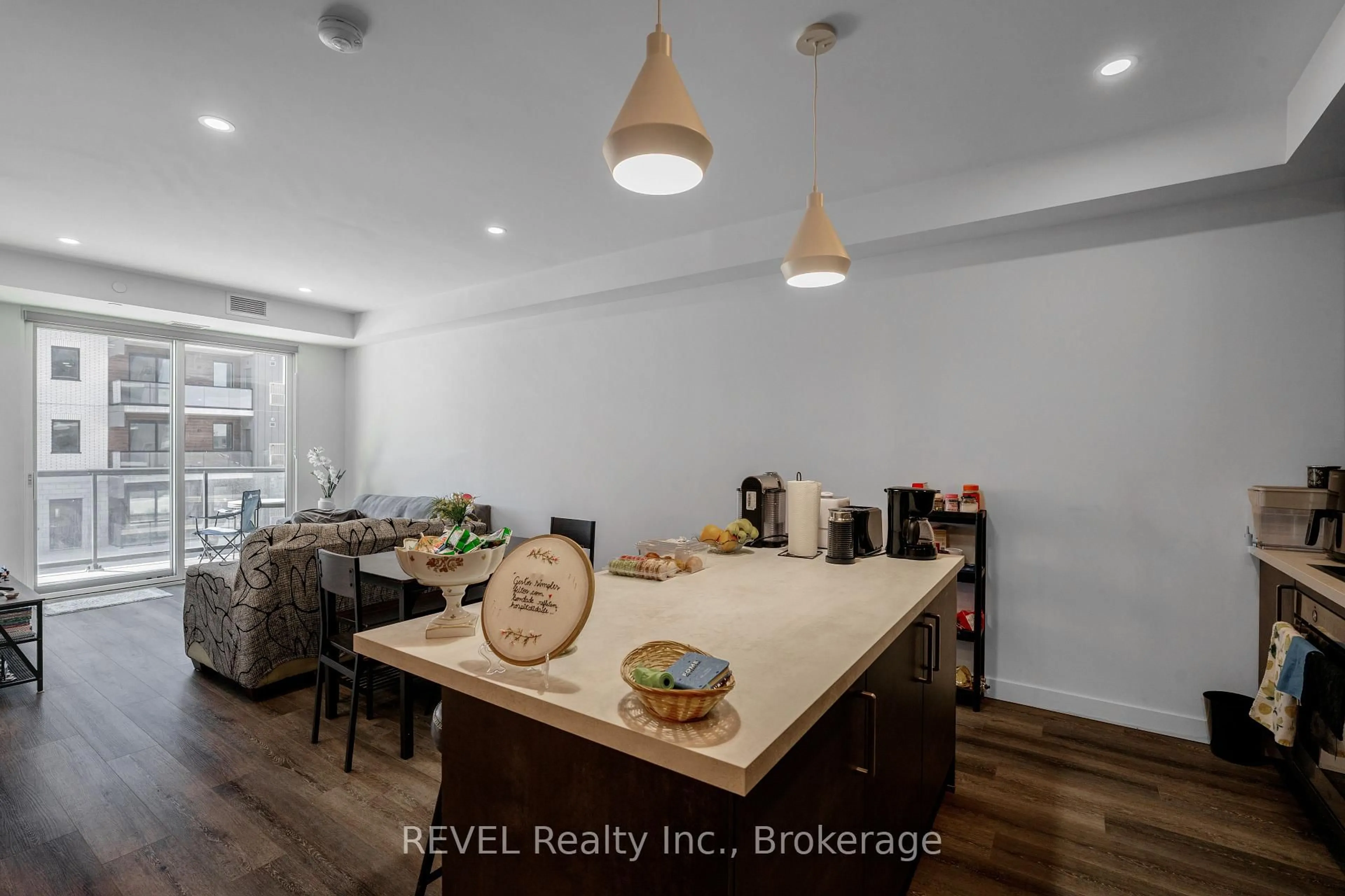 Open concept kitchen, wood/laminate floor for 7549A KALAR Rd #216, Niagara Falls Ontario L2H 2Y6
