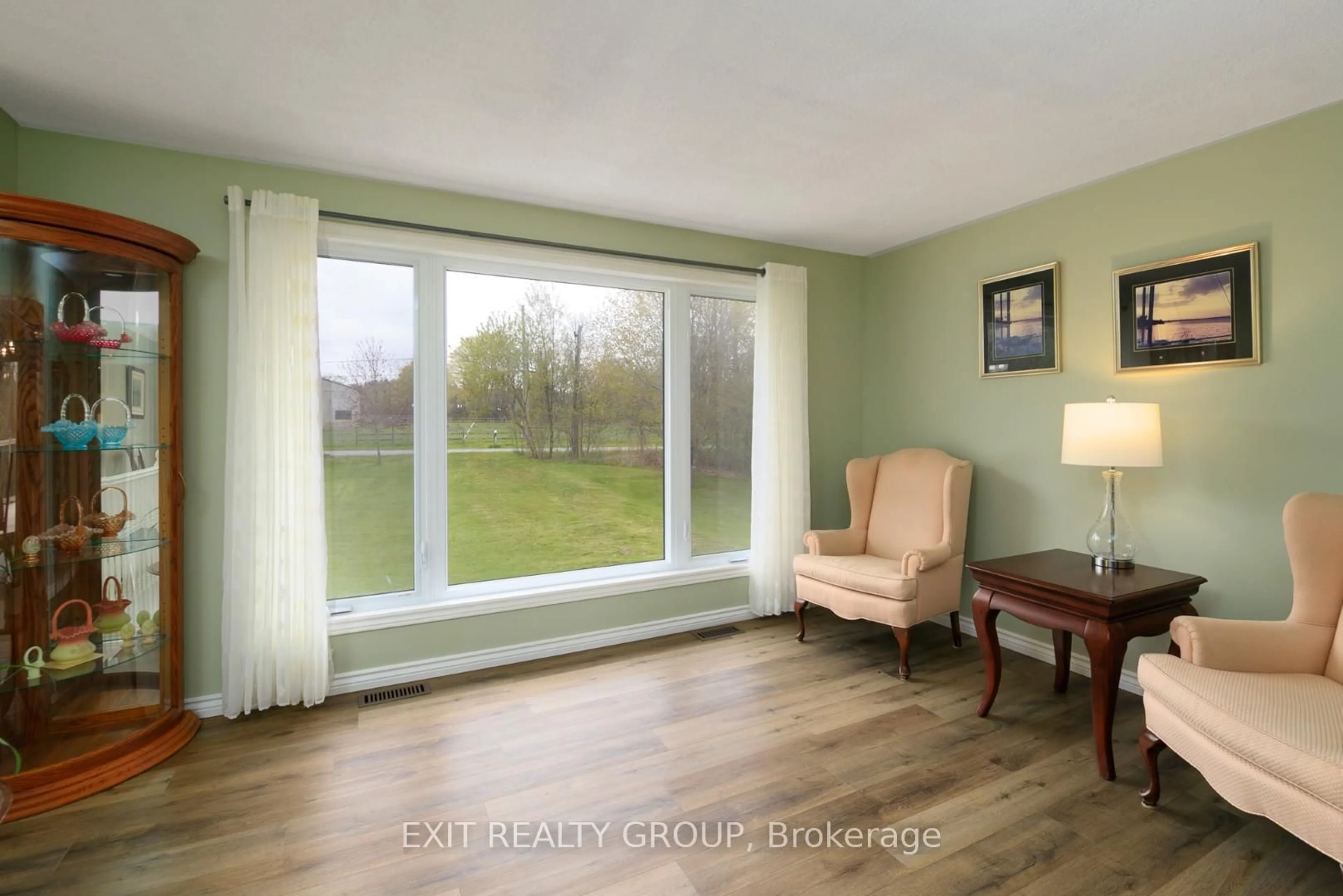 Living room with furniture, wood/laminate floor for 1625 Old Wooler Rd, Quinte West Ontario K0K 3M0