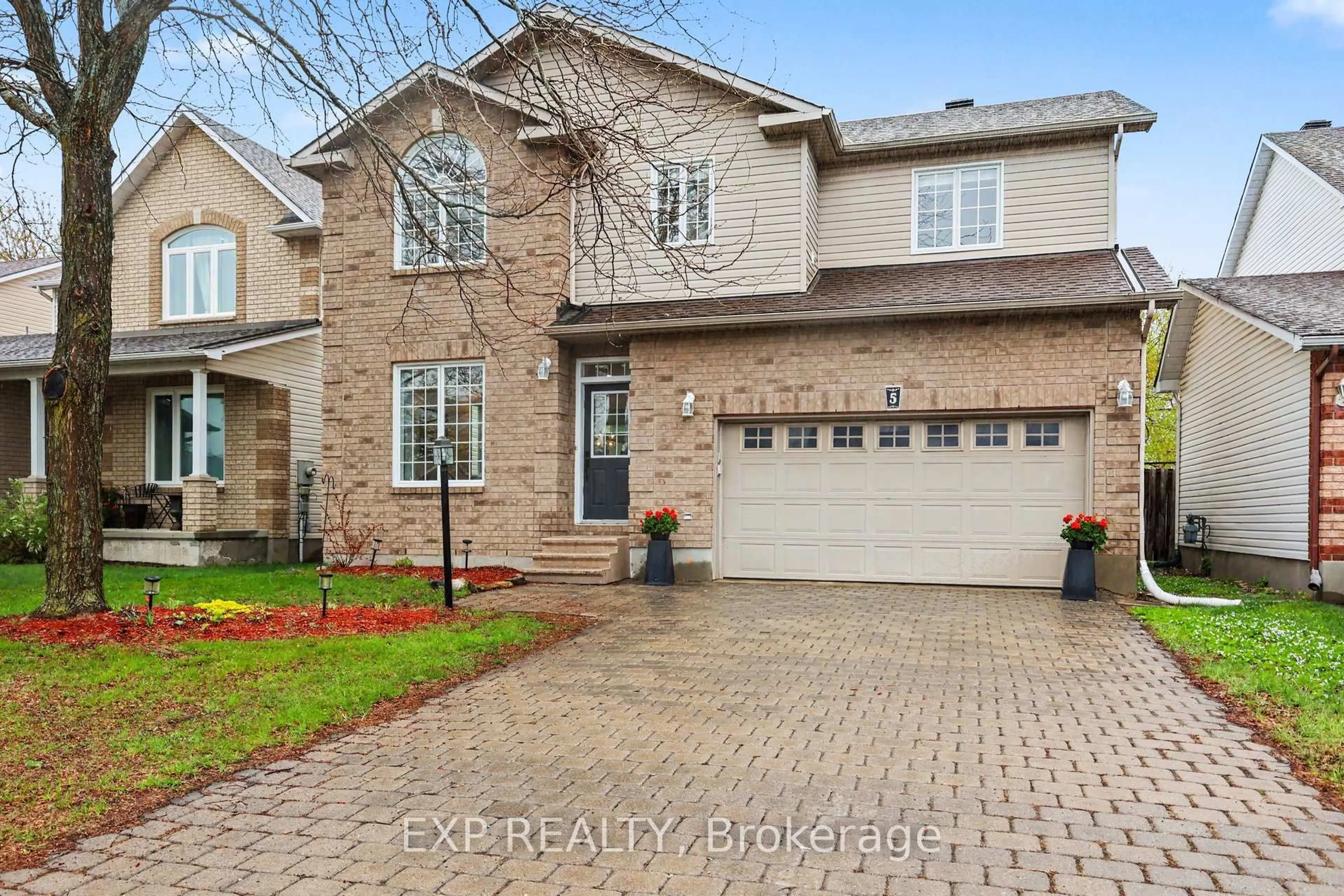 Home with brick exterior material, street for 5 Sundew Crt, Stittsville Ontario K2S 1Z5