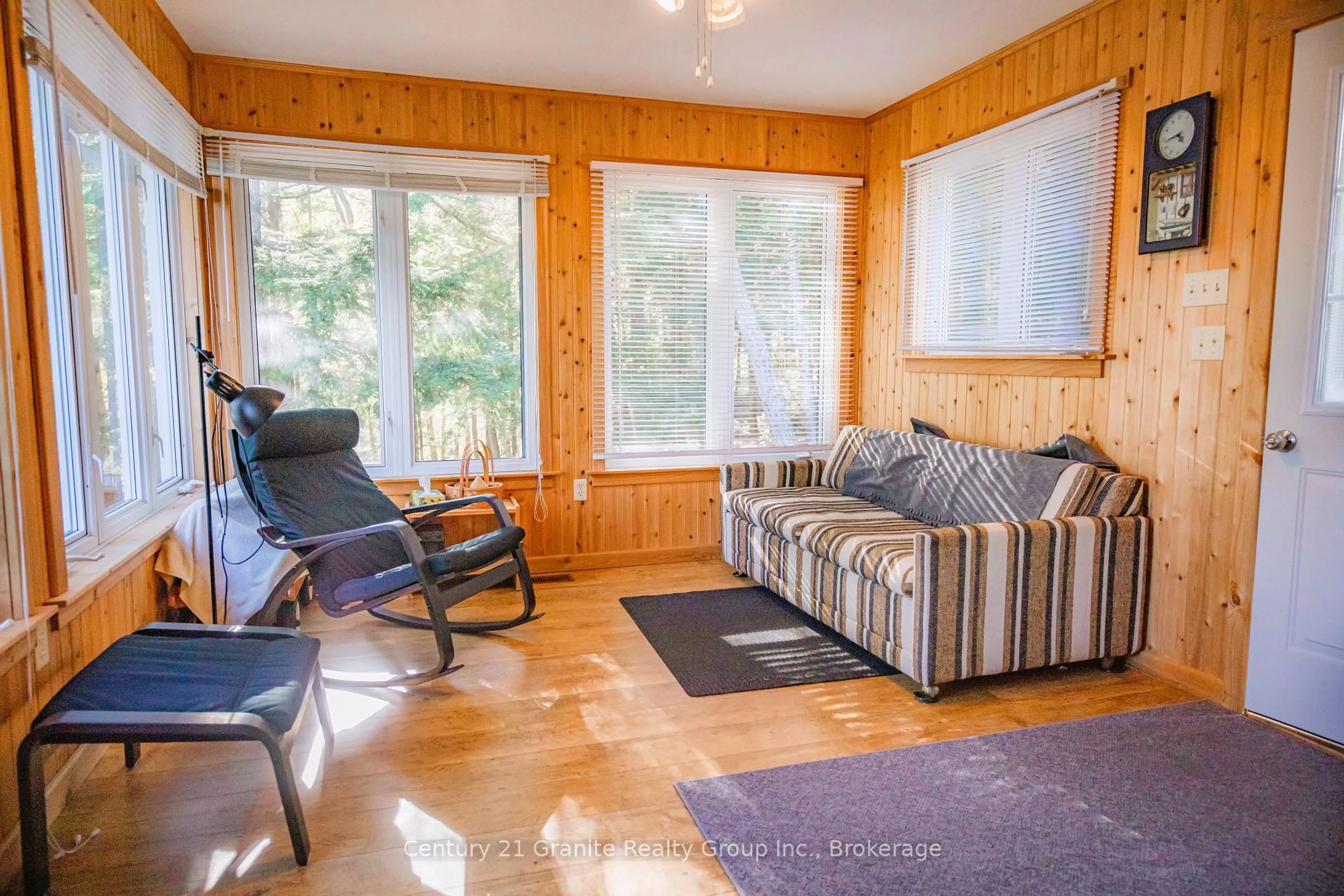 Living room with furniture, wood/laminate floor for 1773 Blue Heron Rd, Dysart et al Ontario K0M 1S0