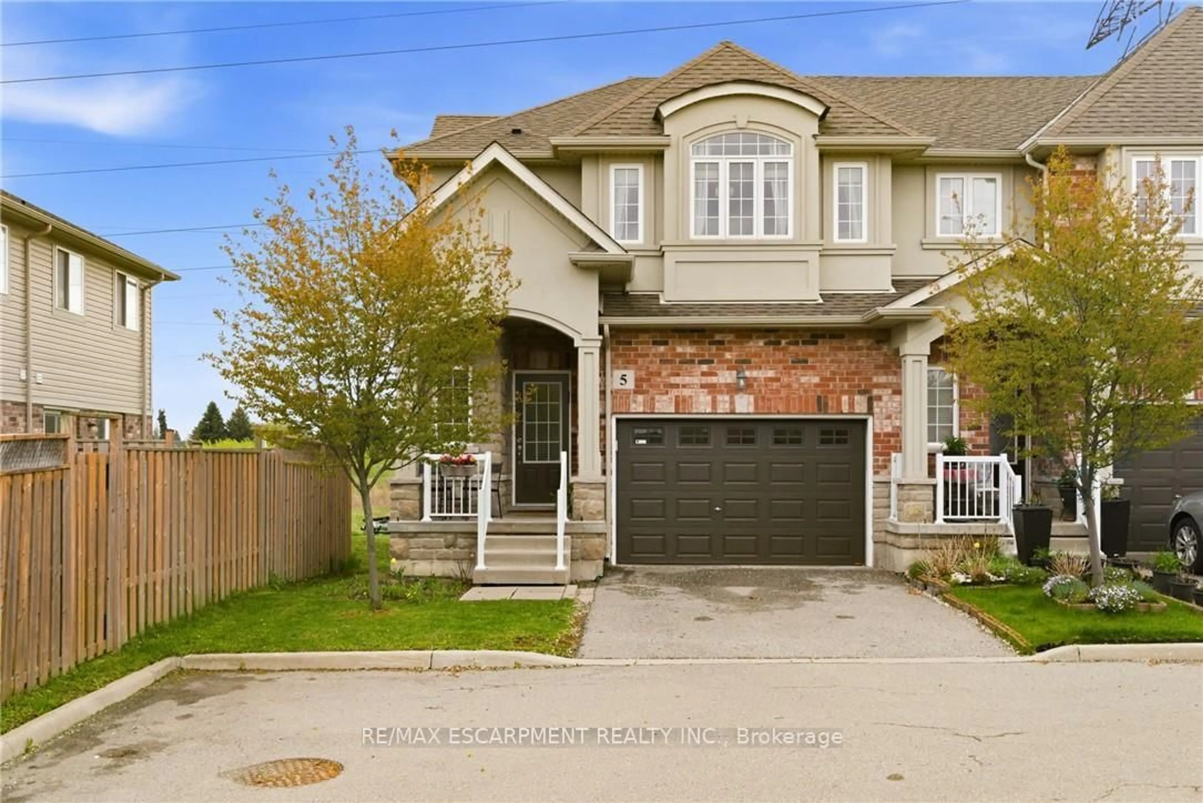 Home with brick exterior material, street for 73 Medici Lane #5, Hamilton Ontario L9B 0H3
