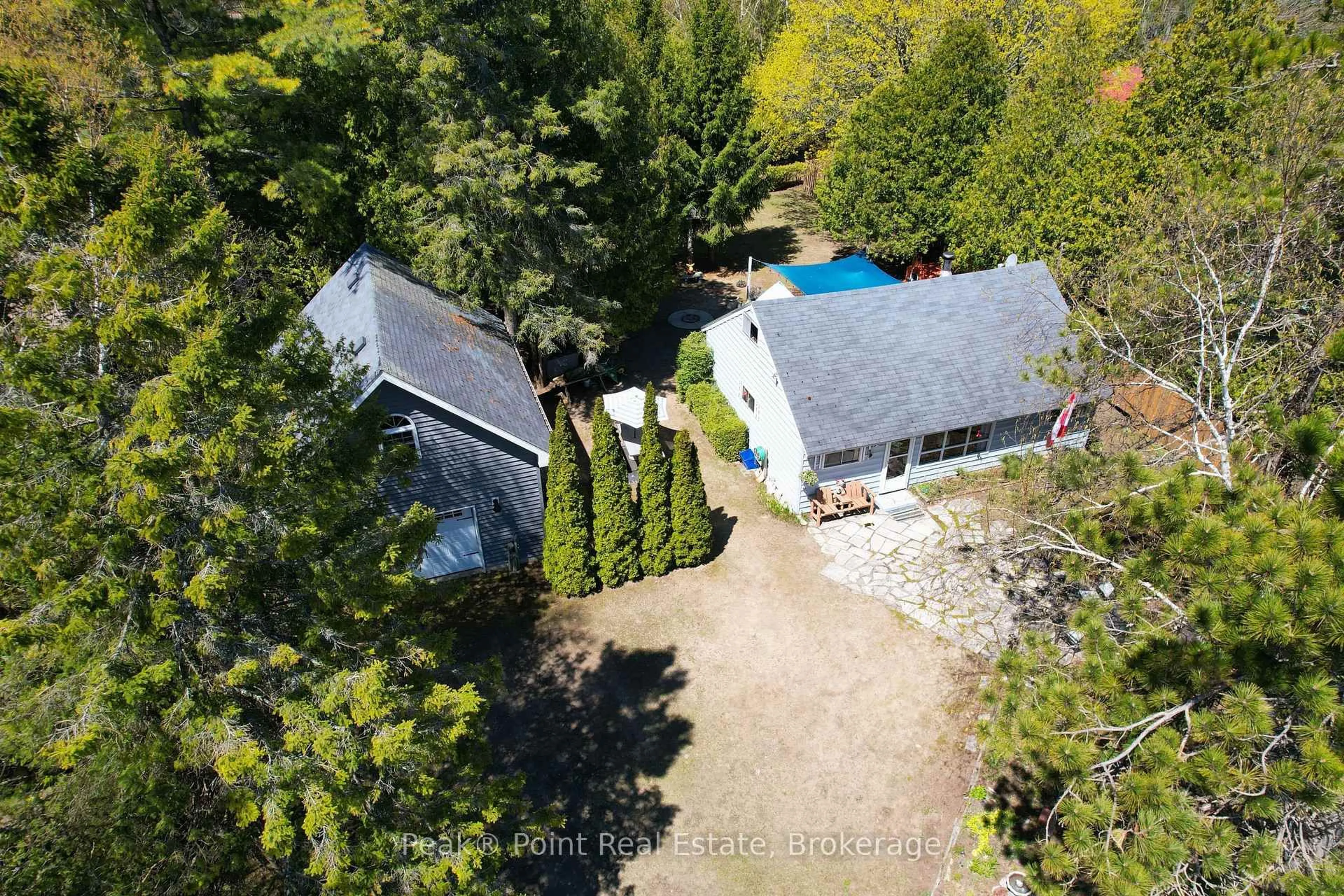 A pic from outside/outdoor area/front of a property/back of a property/a pic from drone, forest/trees view for 20 Clarence Ave, South Bruce Peninsula Ontario N0H 2G0