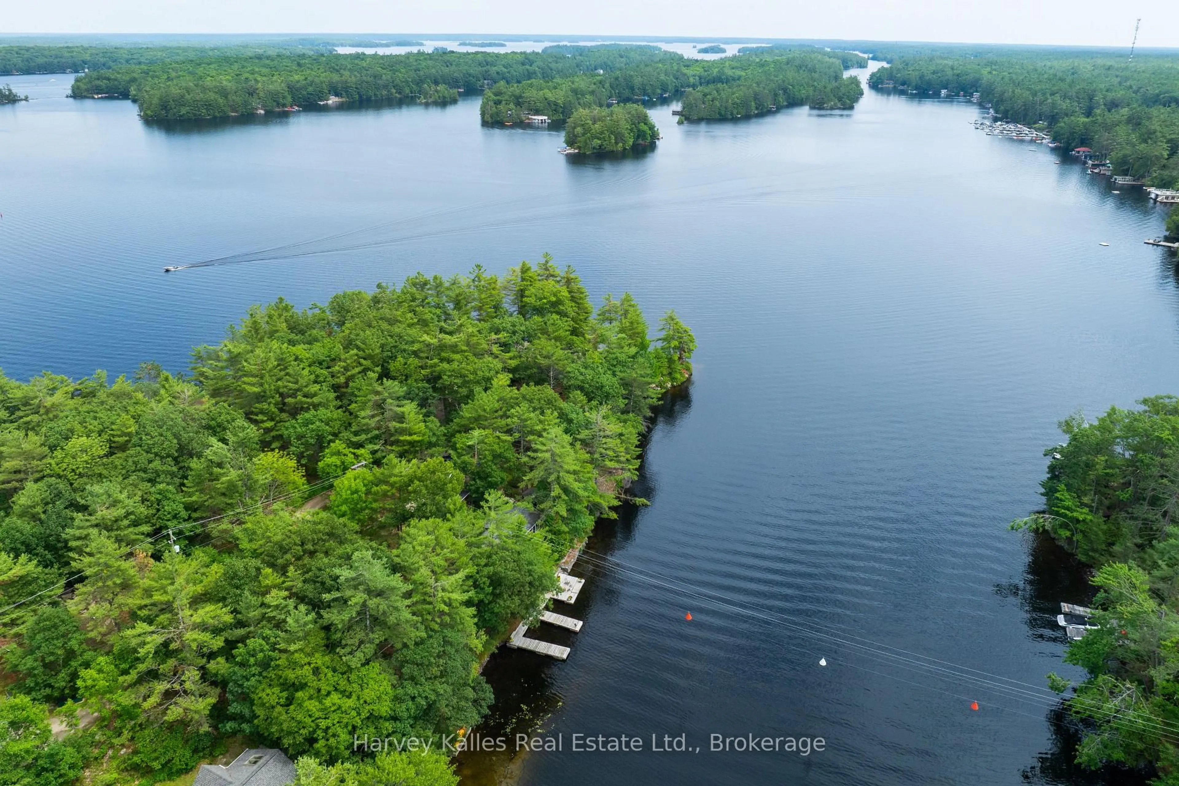 A pic from outside/outdoor area/front of a property/back of a property/a pic from drone, water/lake/river/ocean view for 1078 Mckenzie Rd, Muskoka Lakes Ontario P1P 1A4