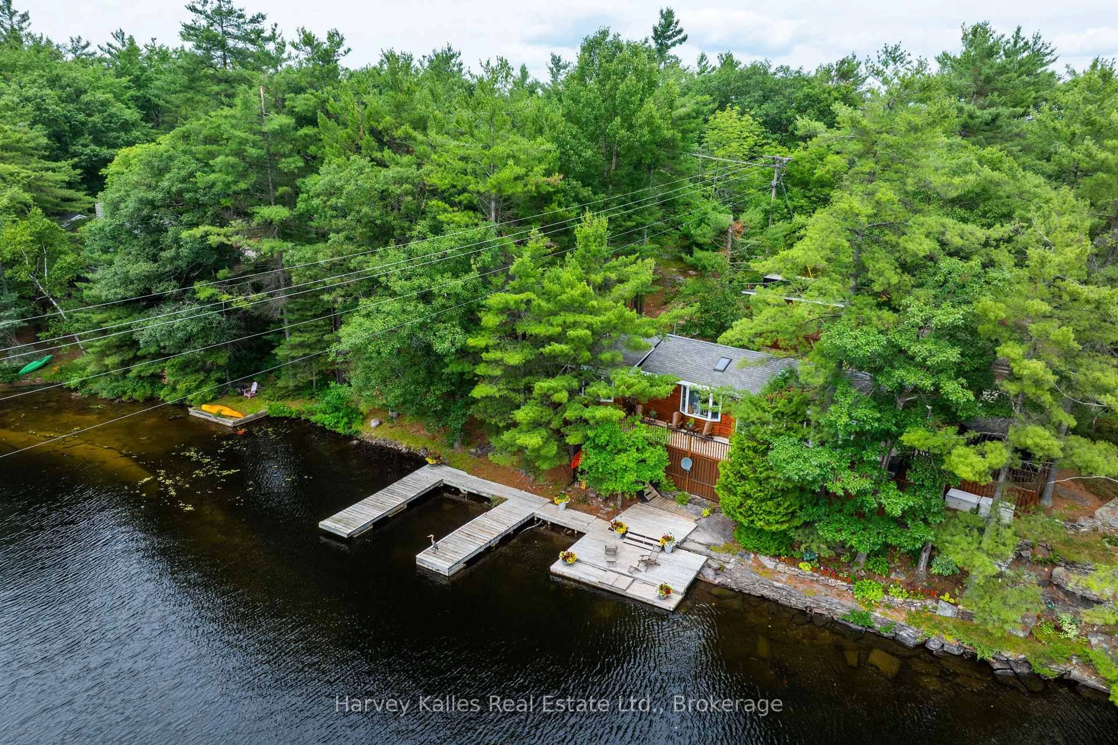 A pic from outside/outdoor area/front of a property/back of a property/a pic from drone, water/lake/river/ocean view for 1078 Mckenzie Rd, Muskoka Lakes Ontario P1P 1A4