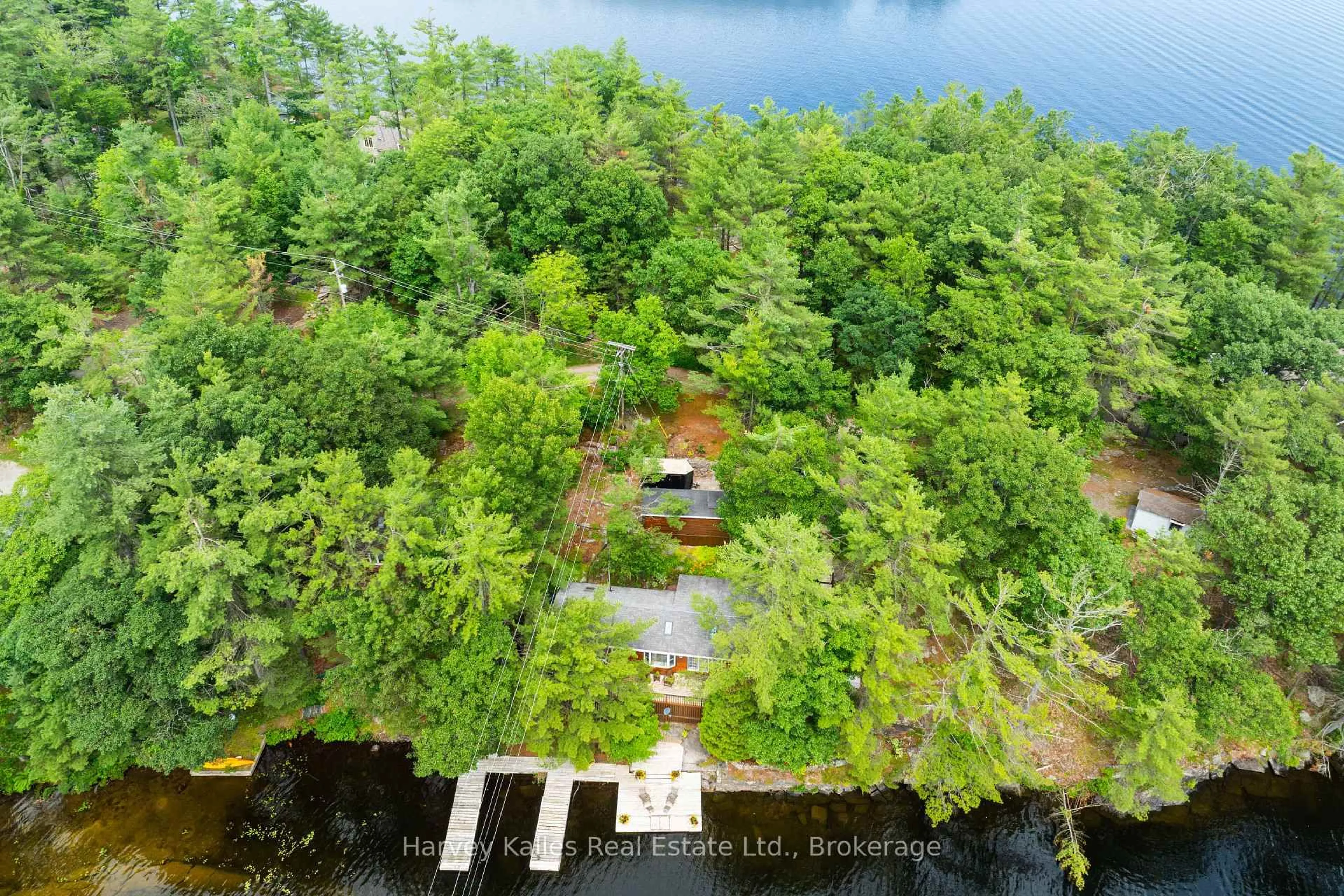 A pic from outside/outdoor area/front of a property/back of a property/a pic from drone, water/lake/river/ocean view for 1078 Mckenzie Rd, Muskoka Lakes Ontario P1P 1A4