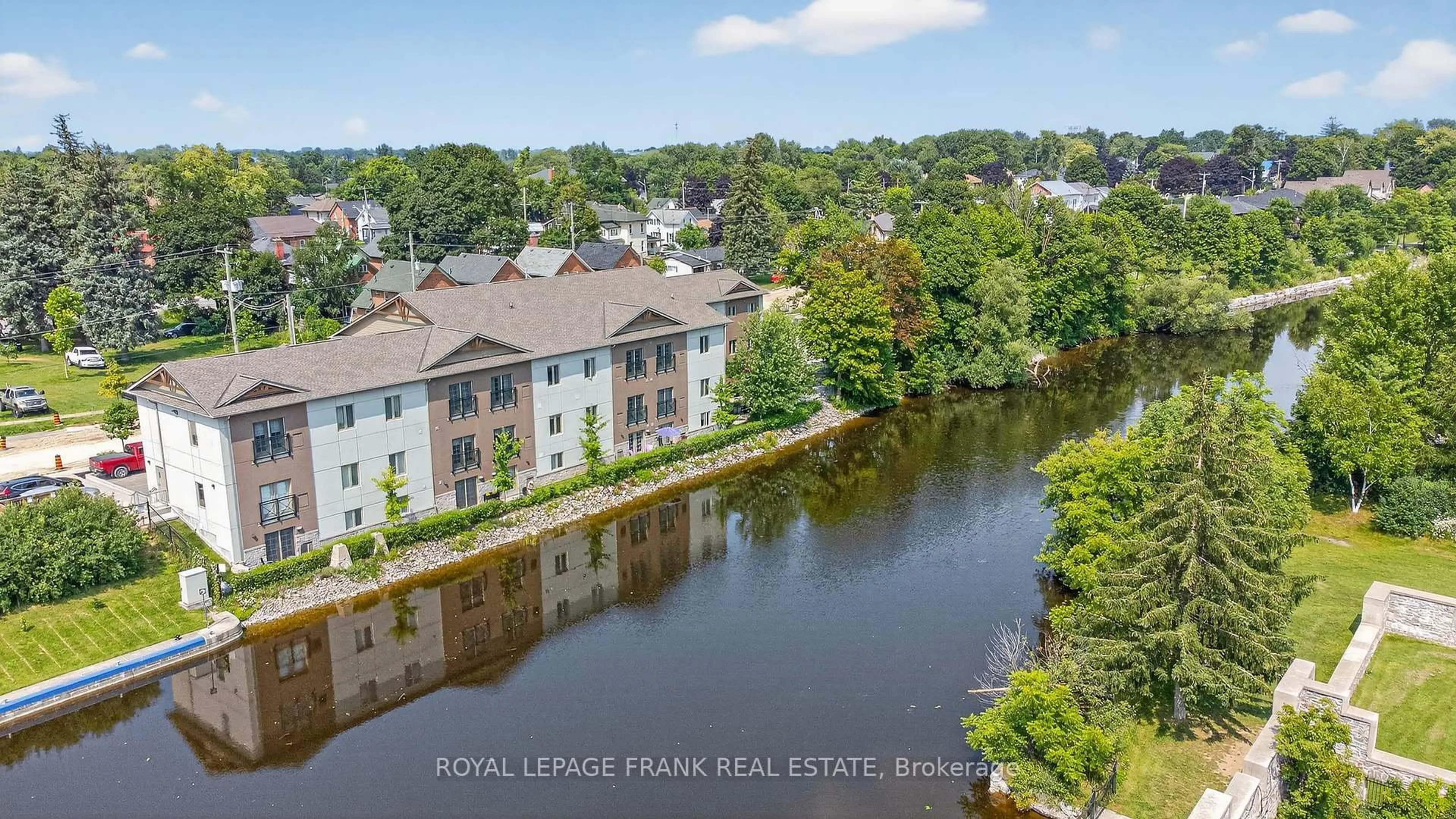 A pic from outside/outdoor area/front of a property/back of a property/a pic from drone, water/lake/river/ocean view for 25 King St #103, Kawartha Lakes Ontario K9V 1C7