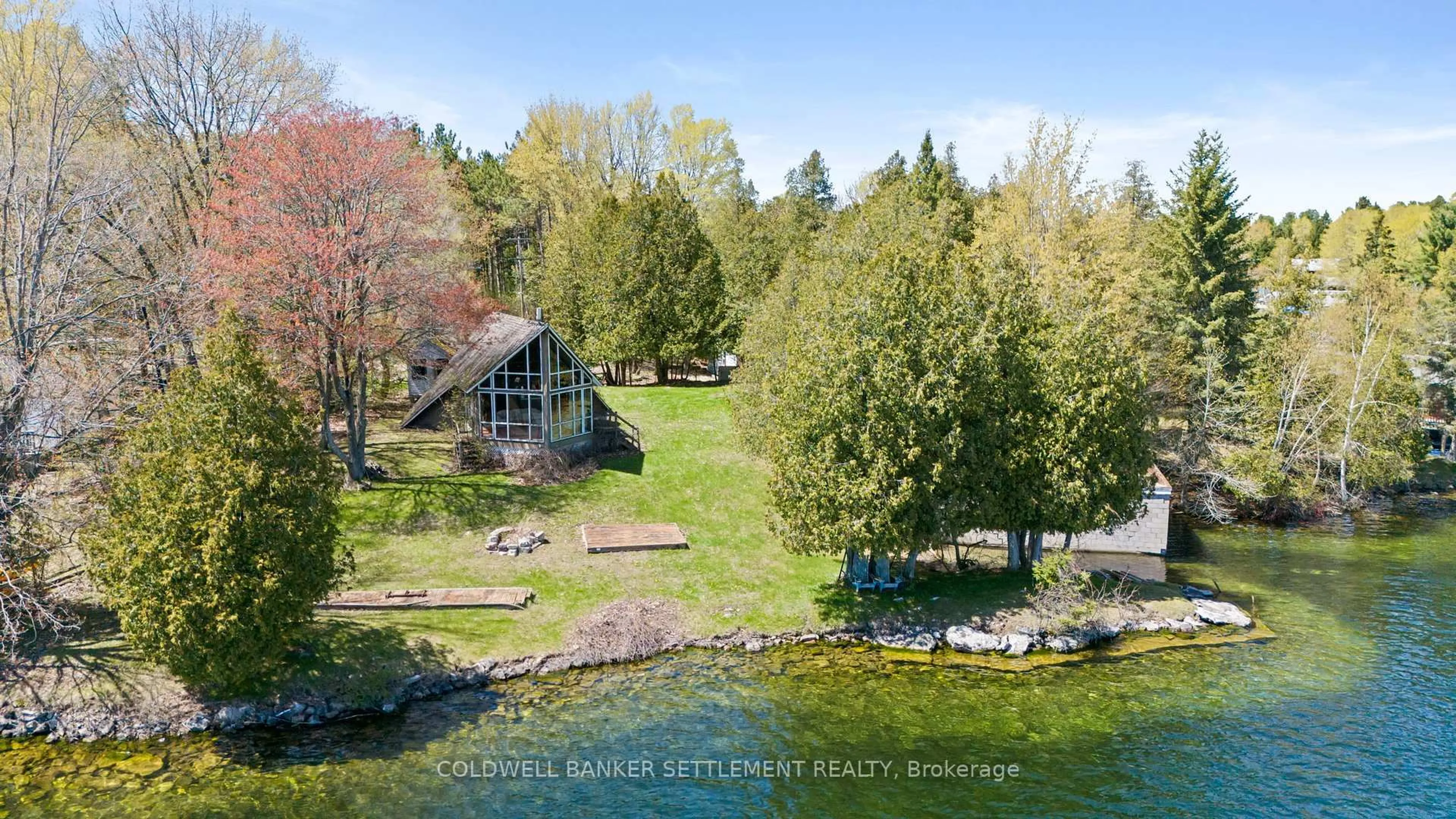 A pic from outside/outdoor area/front of a property/back of a property/a pic from drone, water/lake/river/ocean view for 303 Dragonfly Lane, Perth Ontario K7H 3C7