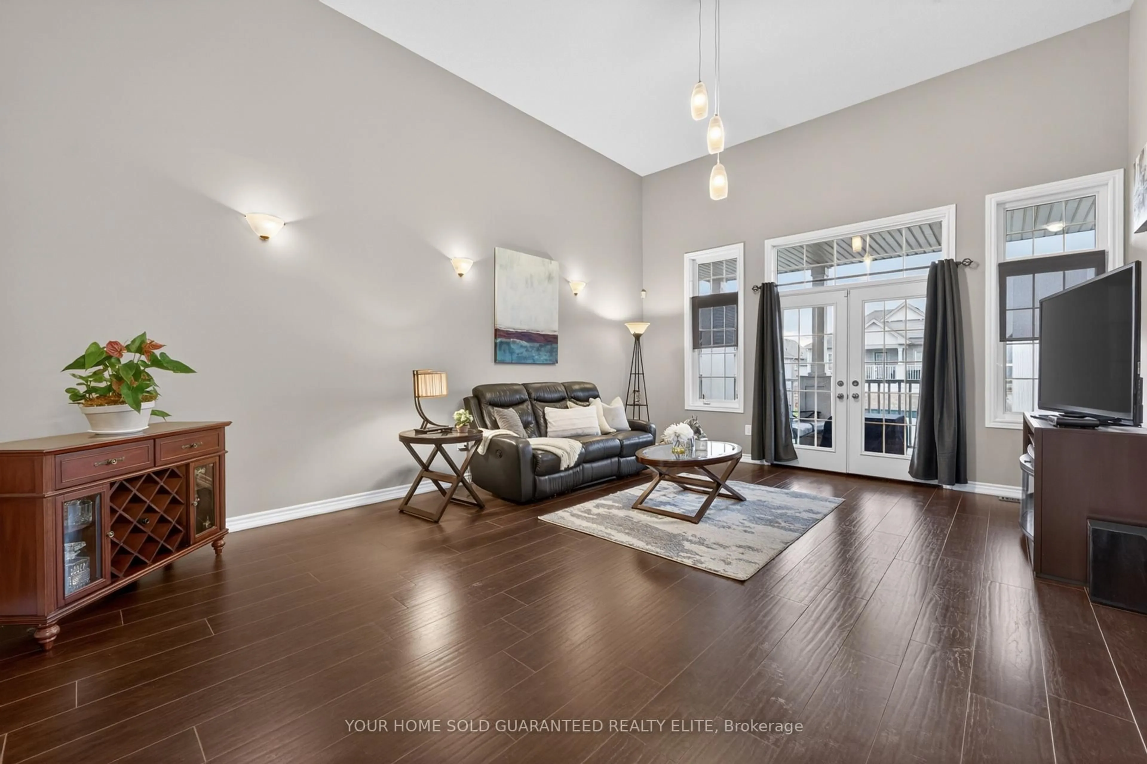 Living room with furniture, wood/laminate floor for 136 Whitwell Way, Hamilton Ontario L0R 1C0