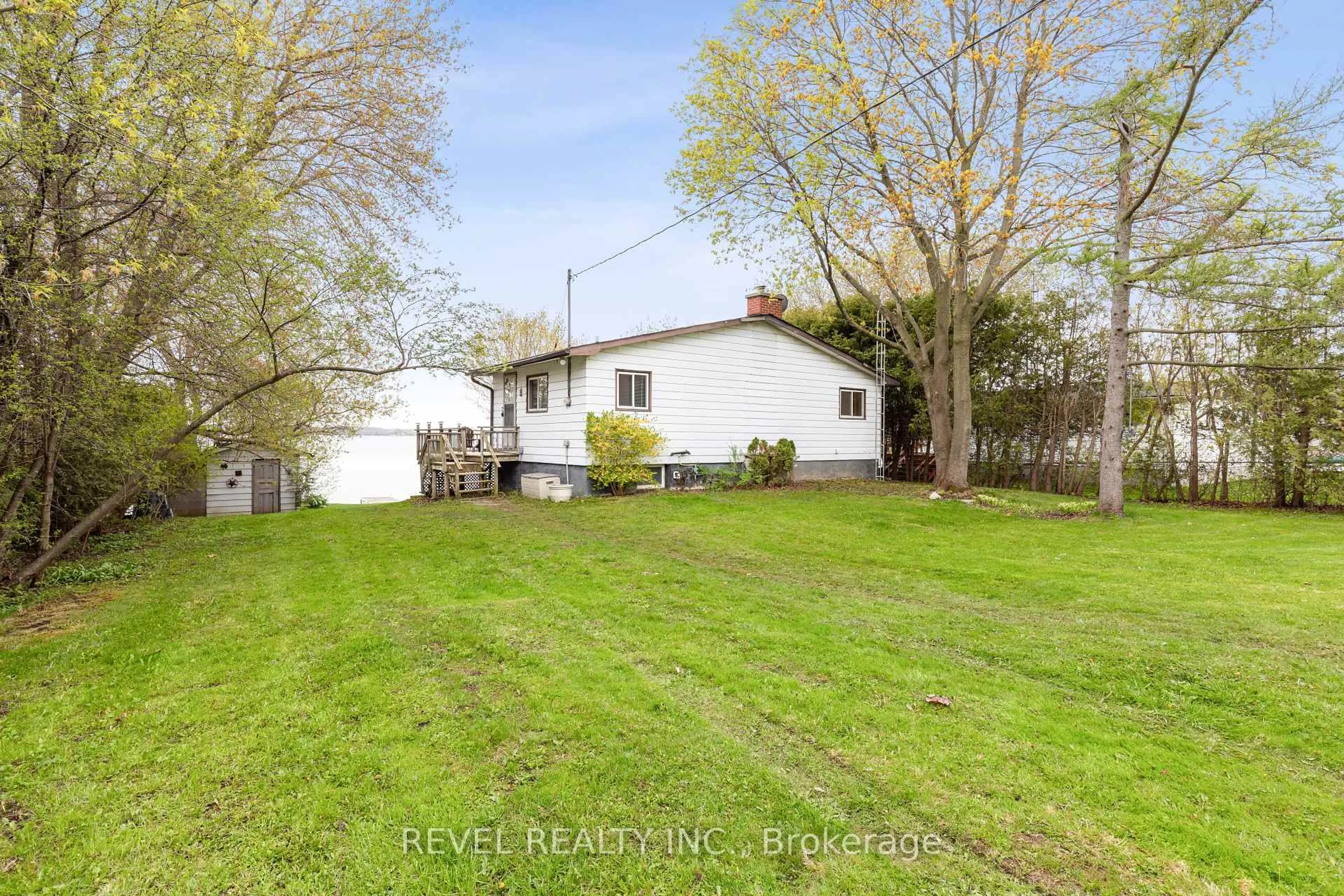 A pic from outside/outdoor area/front of a property/back of a property/a pic from drone, water/lake/river/ocean view for 18 Lakeview Blvd, Kawartha Lakes Ontario K0M 2C0