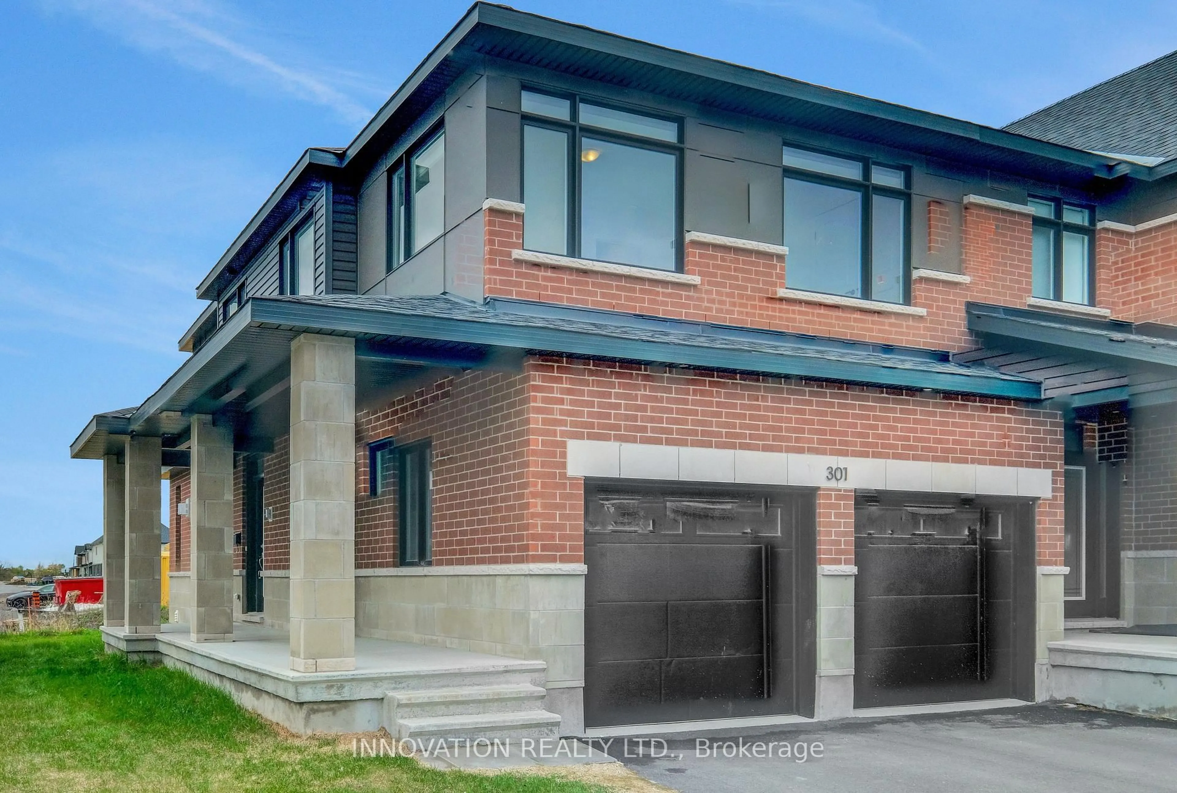 Home with brick exterior material, street for 301 Makobe Lane, Ottawa Ontario K4M 0L9