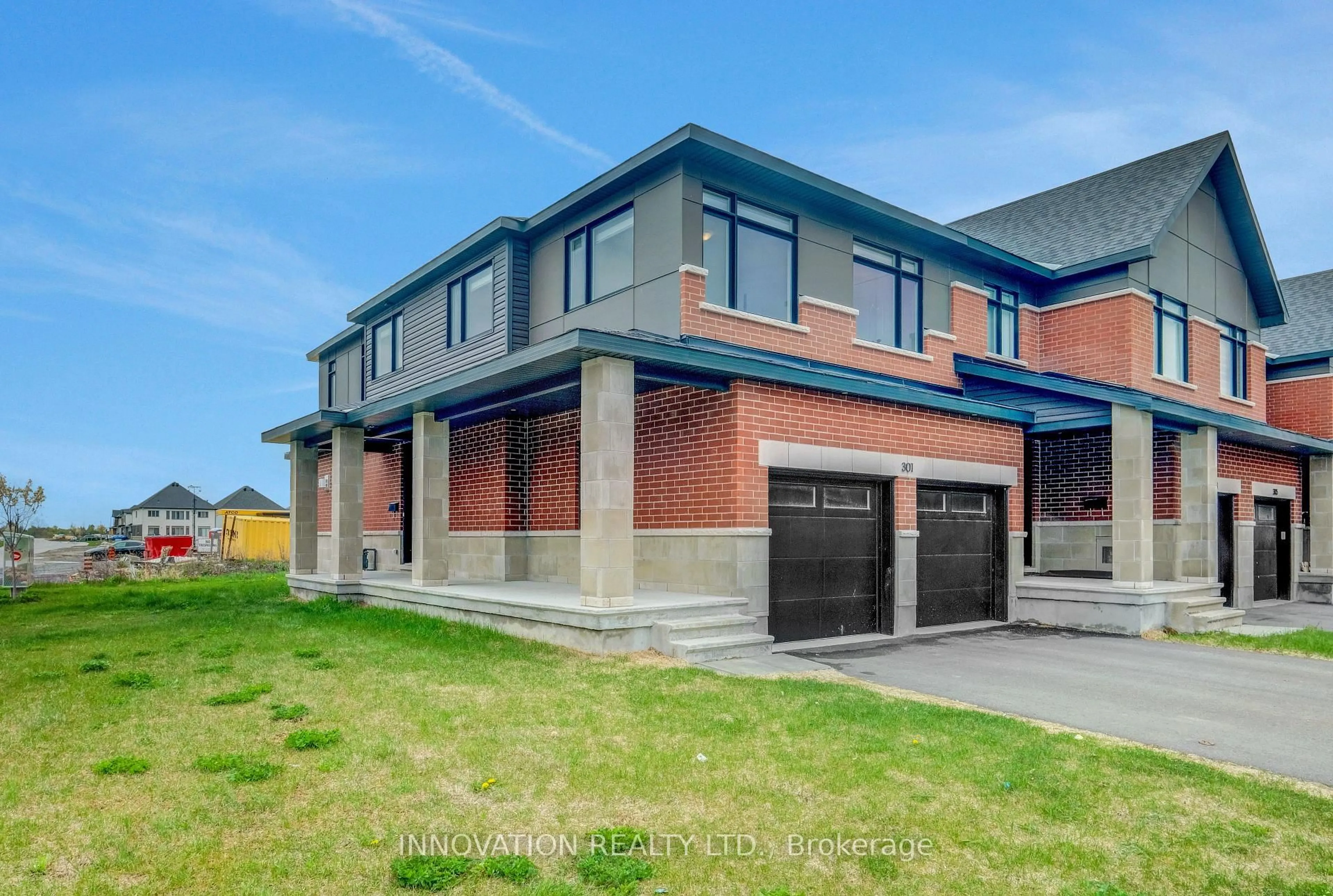 Home with brick exterior material, street for 301 Makobe Lane, Ottawa Ontario K4M 0L9