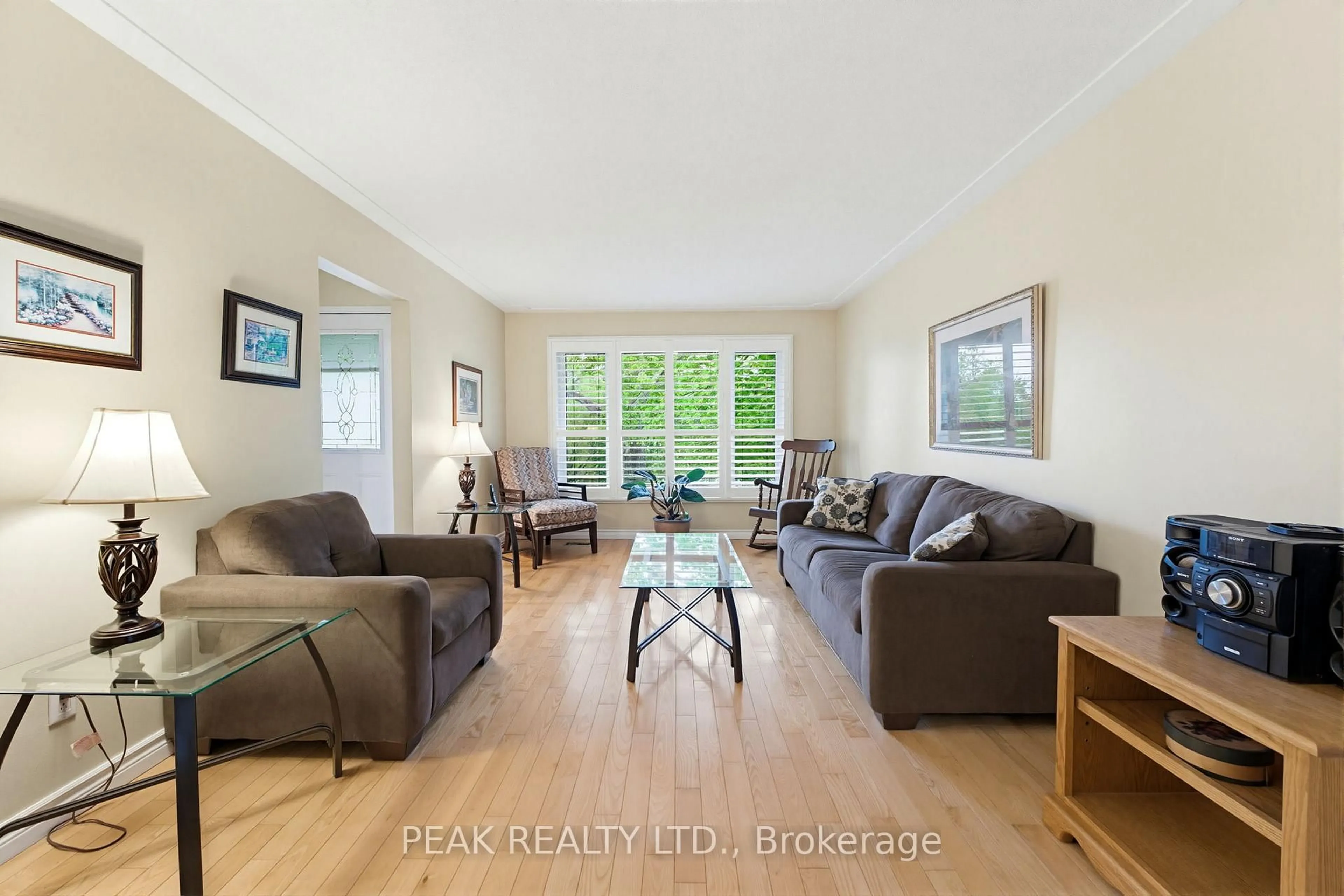 Living room with furniture, wood/laminate floor for 28 Ridgewood Dr, Brantford Ontario N3R 1A3
