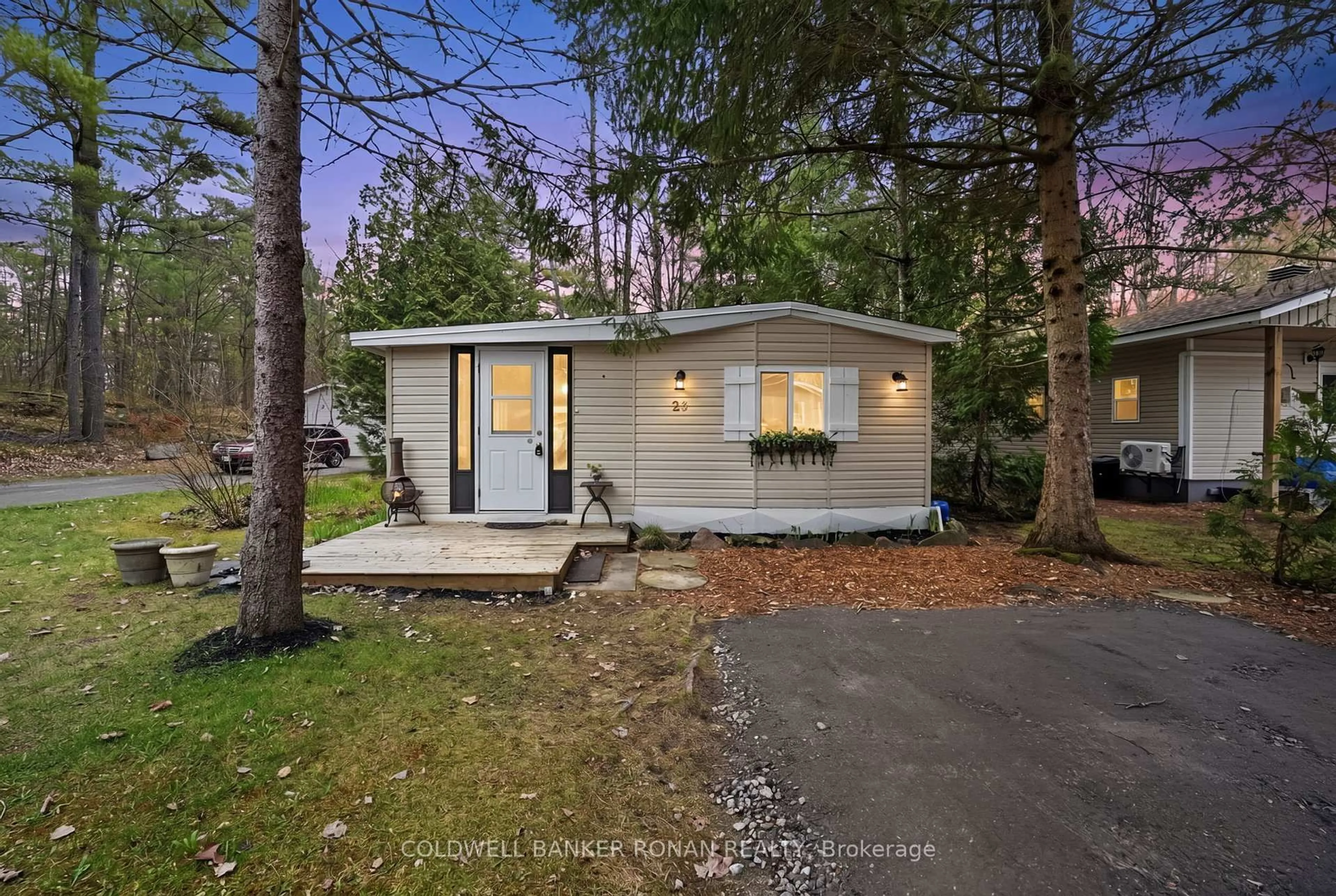 Home with vinyl exterior material, street for 1007 Racoon Rd #23, Gravenhurst Ontario P1P 0C5
