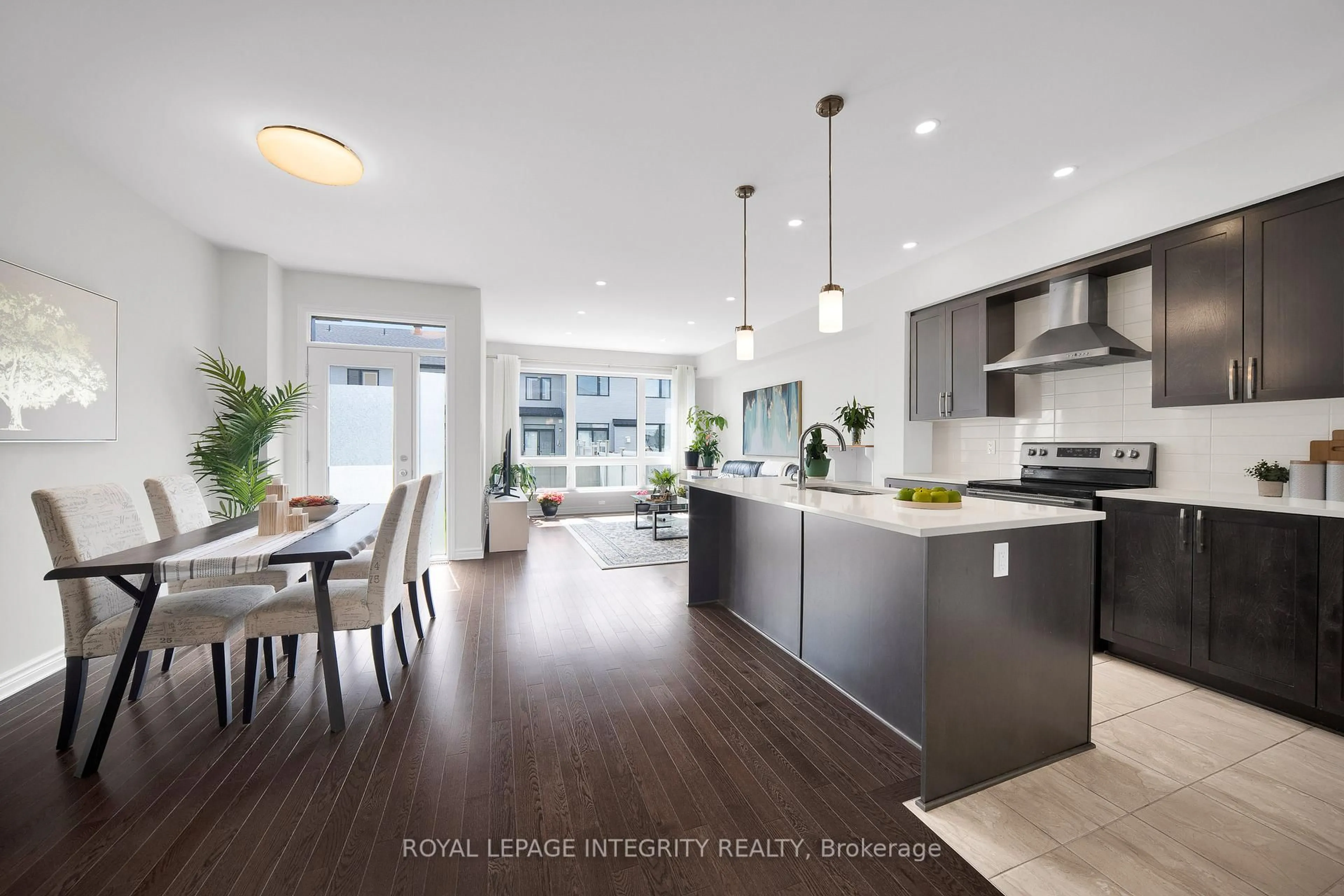 Open concept kitchen, wood/laminate floor for 353 Cornice St, Ottawa Ontario K1W 0P8