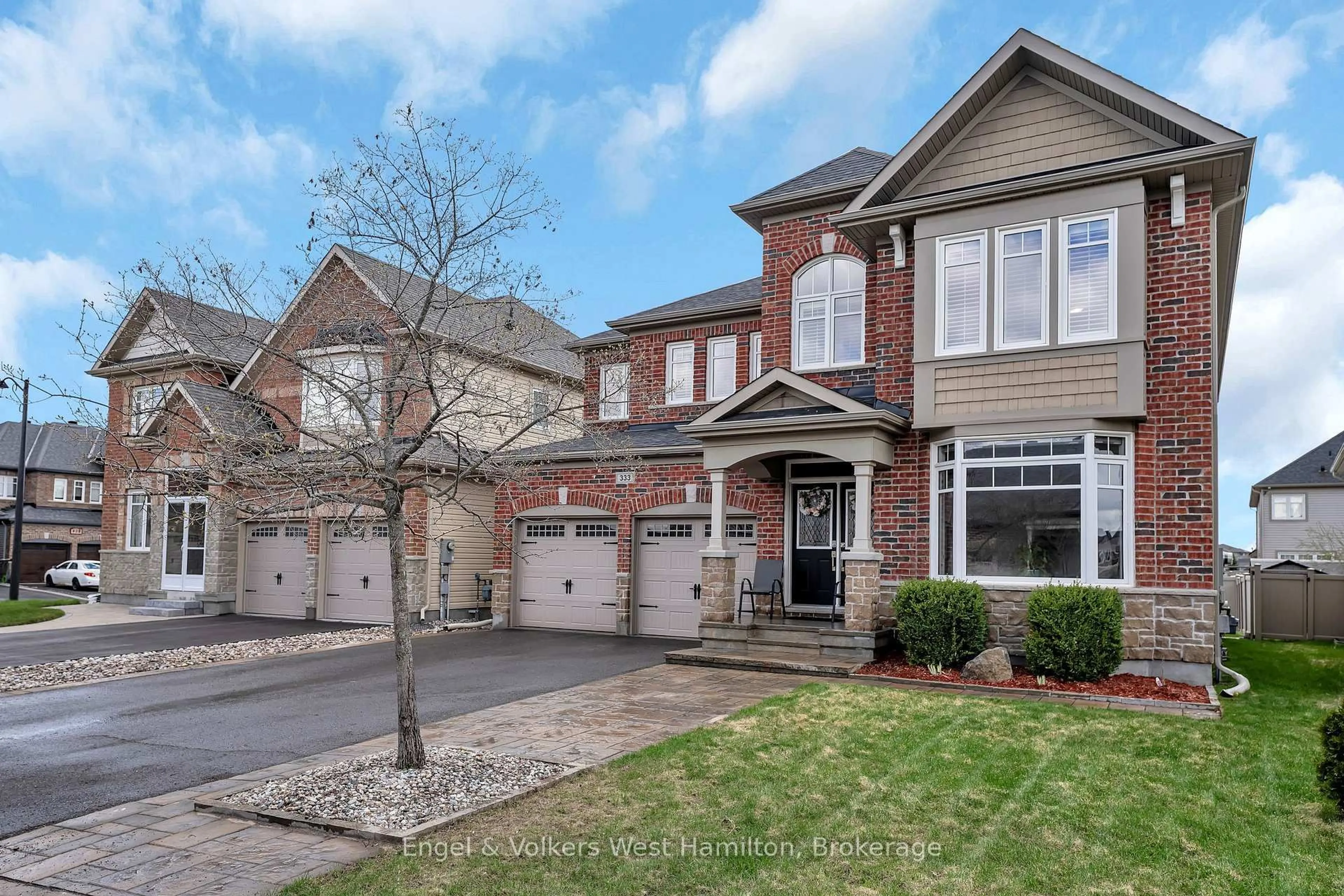 Home with brick exterior material, street for 333 Percheron Way, Stittsville Ontario K2V 0A9