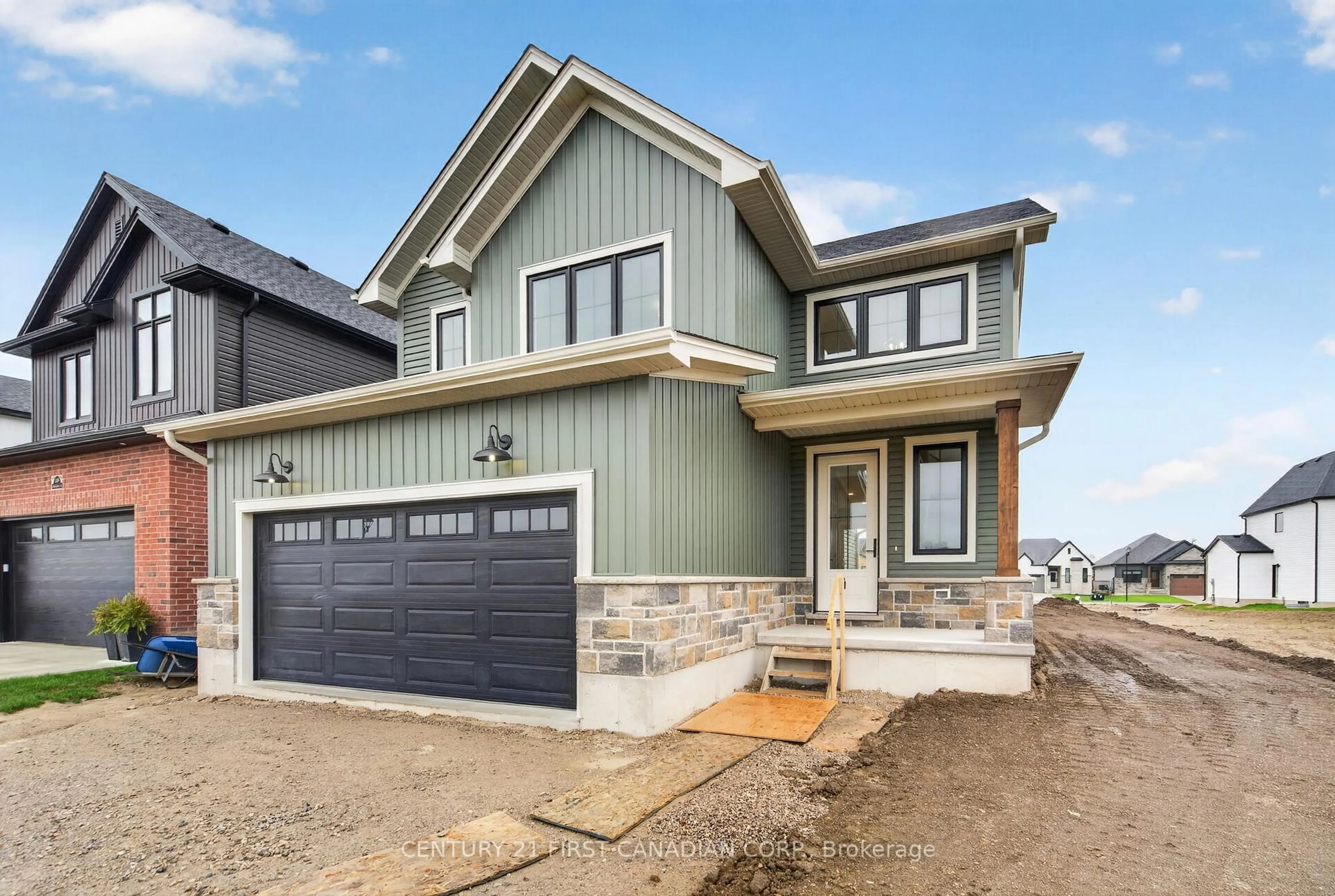 Home with vinyl exterior material, street for 107 Sheldabren St, North Middlesex Ontario N0M 1A0