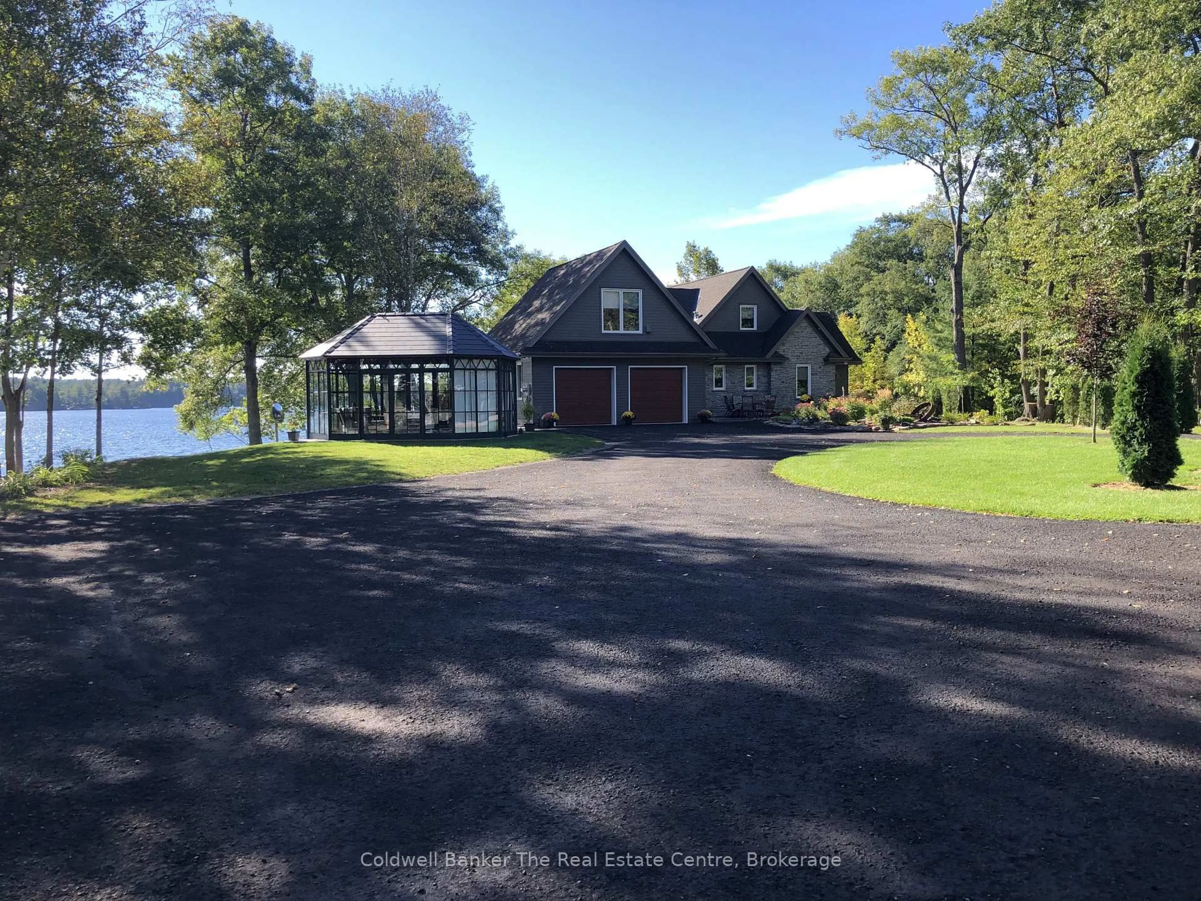 A pic from outside/outdoor area/front of a property/back of a property/a pic from drone, water/lake/river/ocean view for 1012 Green Gables Rd, Minden Hills Ontario K0A 2L1