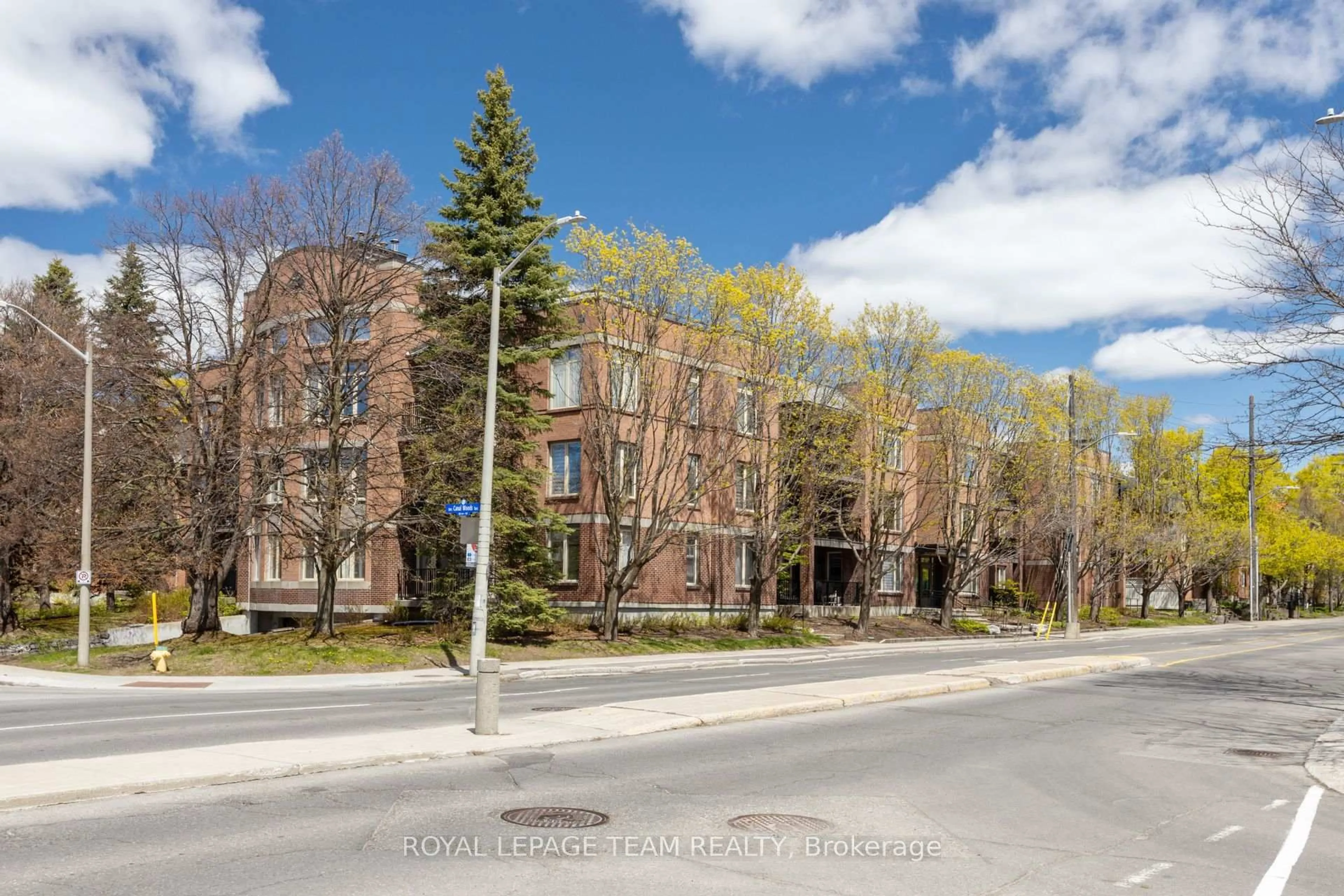 A pic from outside/outdoor area/front of a property/back of a property/a pic from drone, street for 499 Sunnyside Ave #107, Ottawa Ontario K1S 0S8