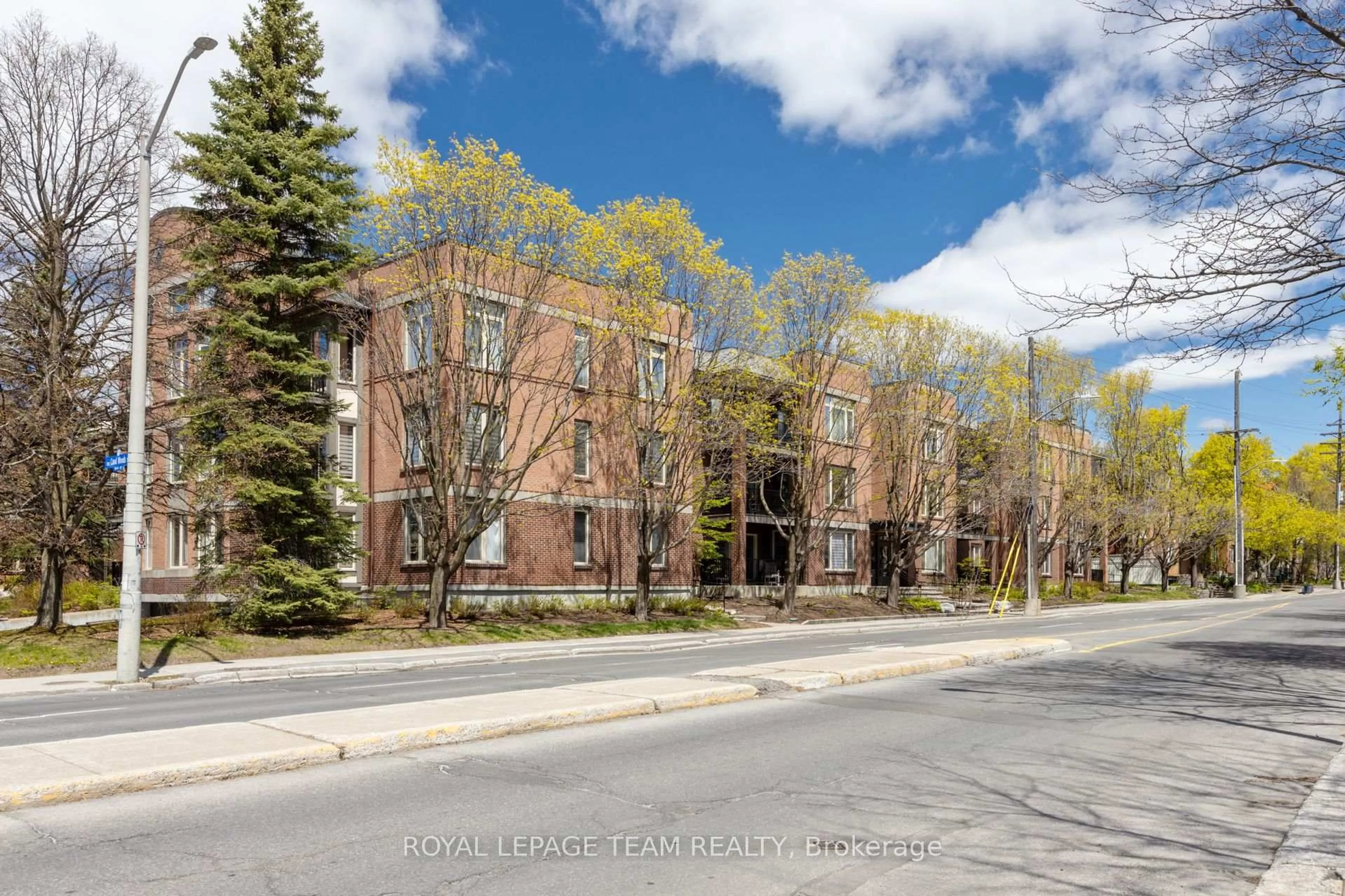 A pic from outside/outdoor area/front of a property/back of a property/a pic from drone, street for 499 Sunnyside Ave #107, Ottawa Ontario K1S 0S8