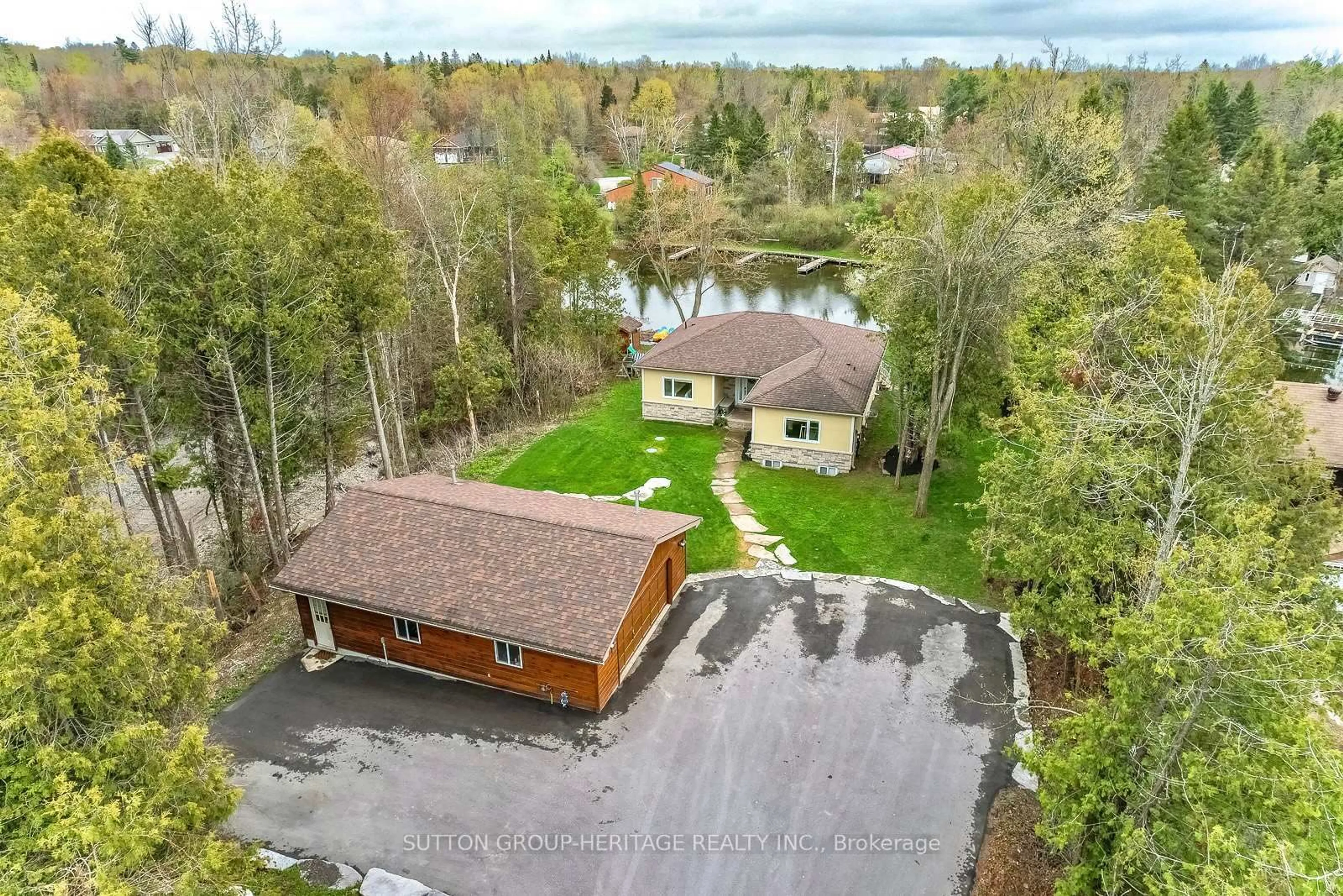 A pic from outside/outdoor area/front of a property/back of a property/a pic from drone, water/lake/river/ocean view for 191 Pirates Glen Dr, Trent Lakes Ontario K0M 1A0