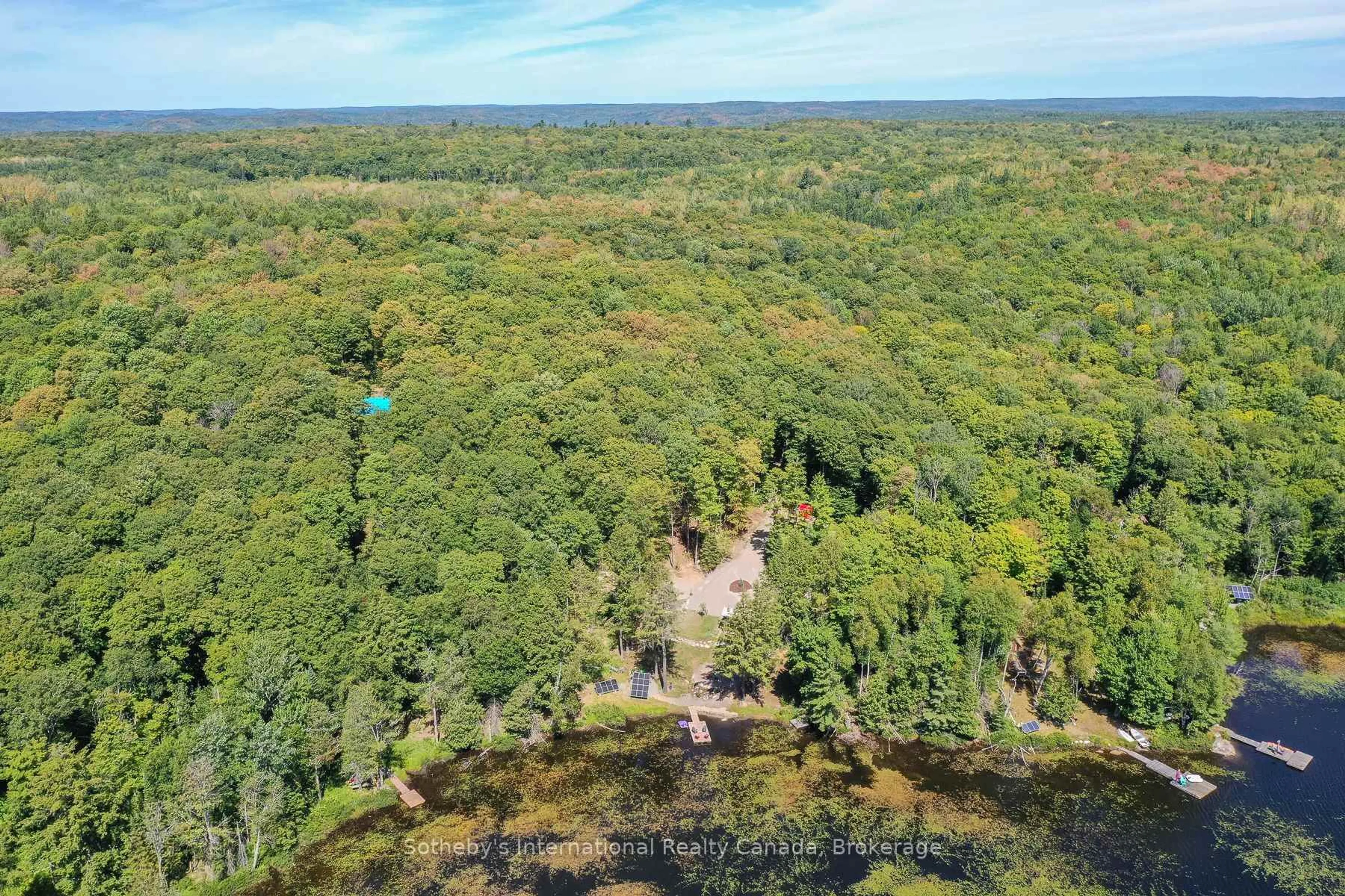 A pic from outside/outdoor area/front of a property/back of a property/a pic from drone, forest/trees view for 1211 Pluto Tr, Dysart et al Ontario K0M 1S0