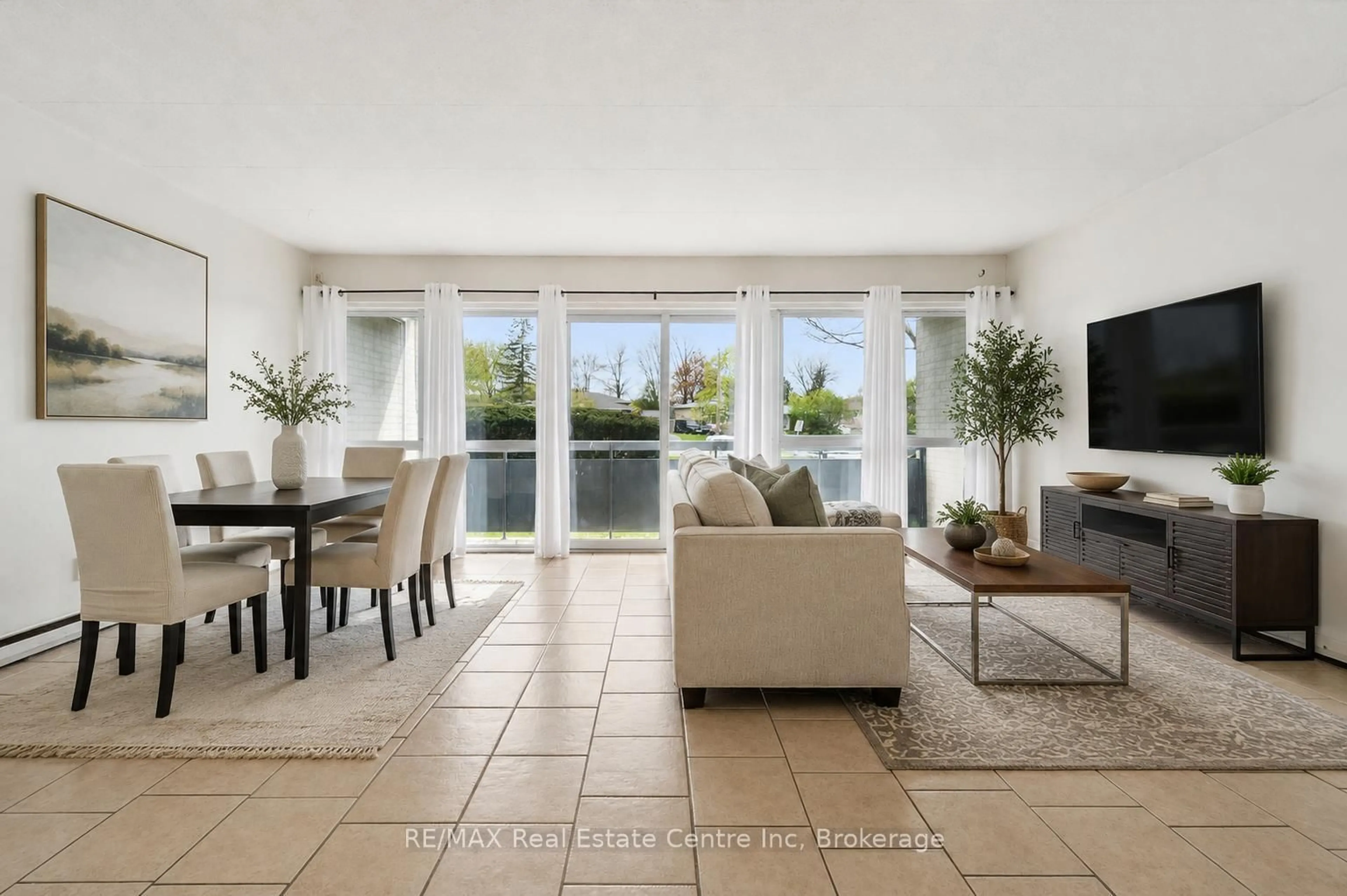Living room with furniture, ceramic/tile floor for 91 Conroy Cres #307, Guelph Ontario N1G 2V5