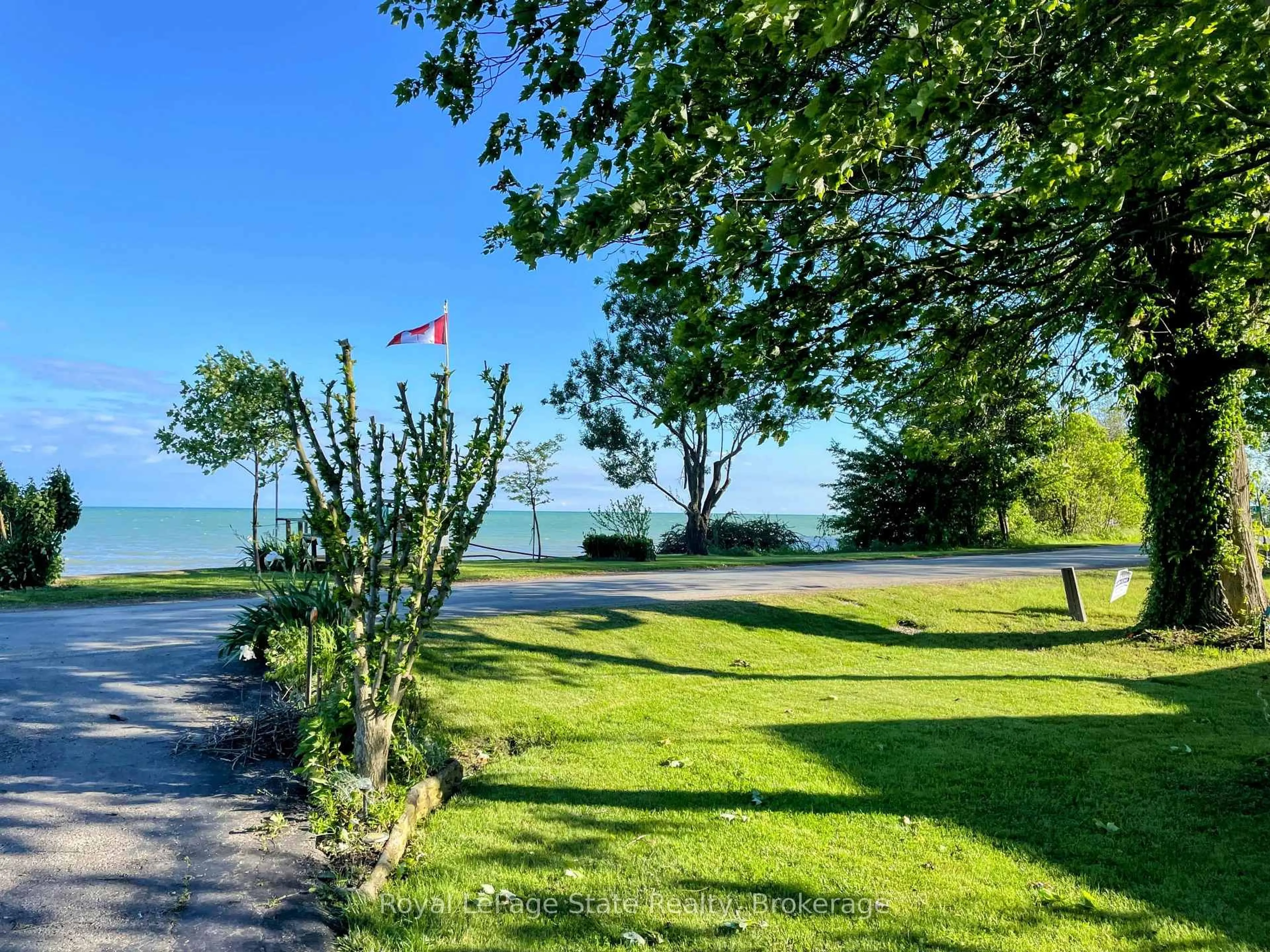 A pic from outside/outdoor area/front of a property/back of a property/a pic from drone, water/lake/river/ocean view for 1323 Lakeshore Rd, Haldimand Ontario N0A 1P0