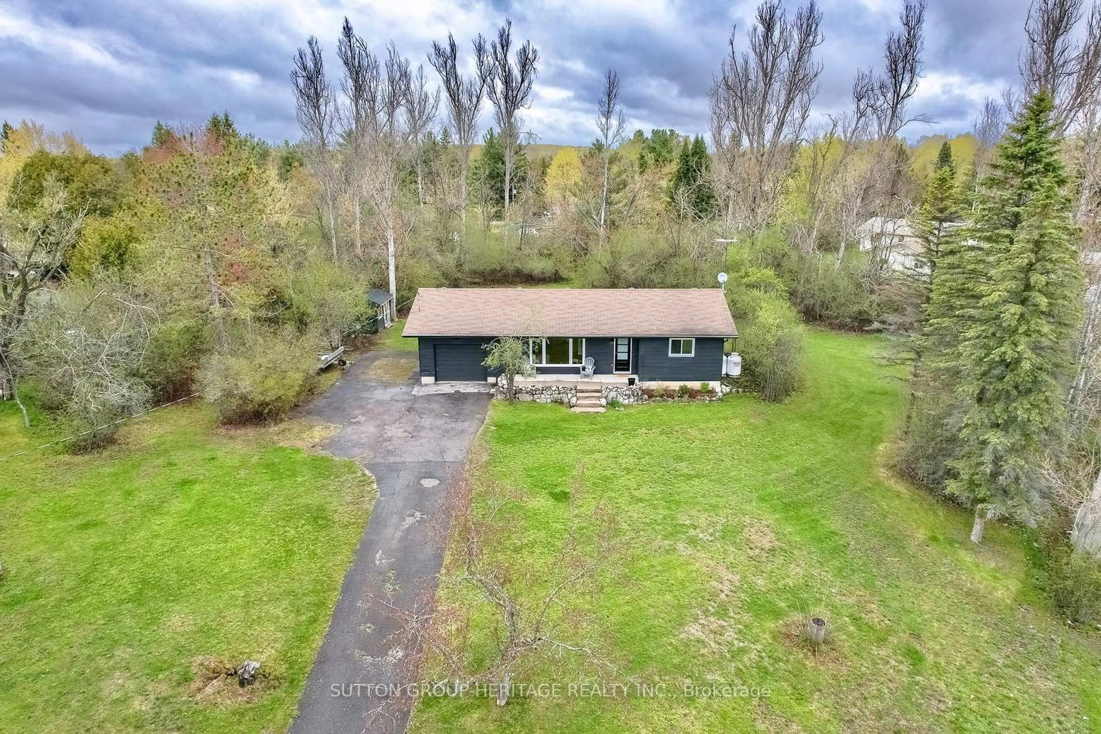 A pic from outside/outdoor area/front of a property/back of a property/a pic from drone, unknown for 11 Swiss Cres, Trent Lakes Ontario K0M 1A0
