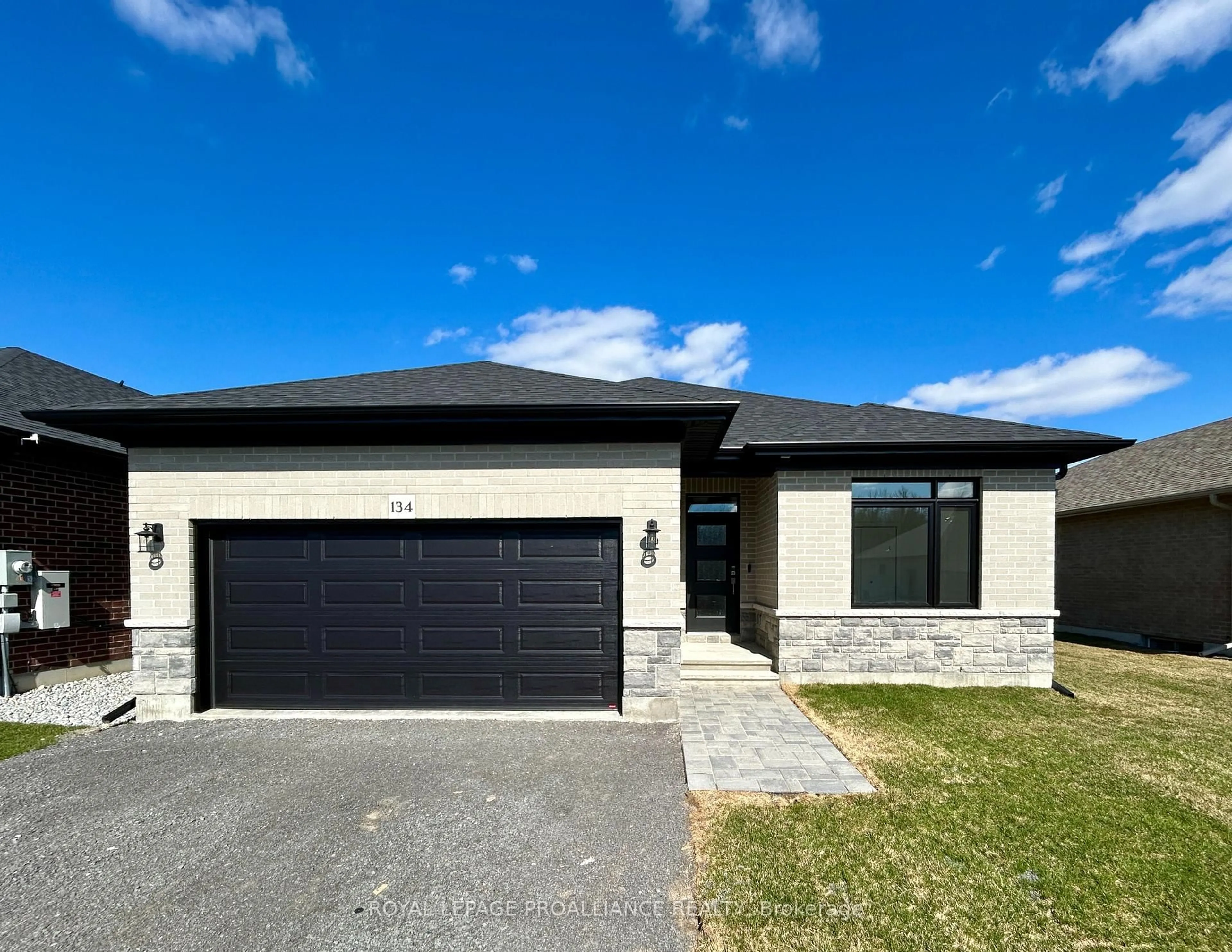 Home with brick exterior material, street for 134 Stonecrest Blvd, Quinte West Ontario K8R 0B4